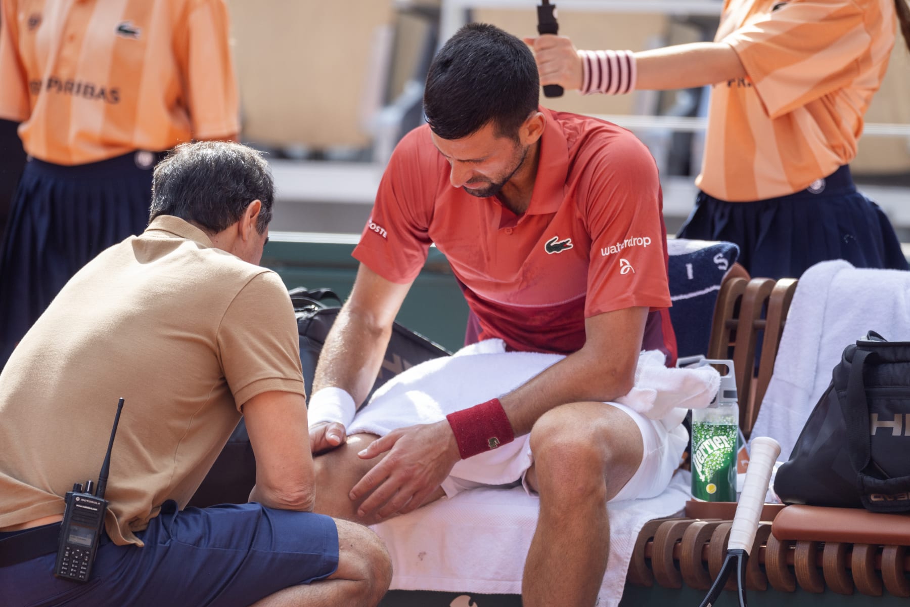 PARIS, FRANCE - June 03:  Novak Djokovic of Serbia receives treatment for his knee injury during his match against Francisco Cerundolo of Argentina on Court Philippe-Chatrier during the fourth round of the 2024 French Open Tennis Tournament at Roland Garros on June 3rd, 2024, in Paris, France. (Photo by Tim Clayton/Corbis via Getty Images)