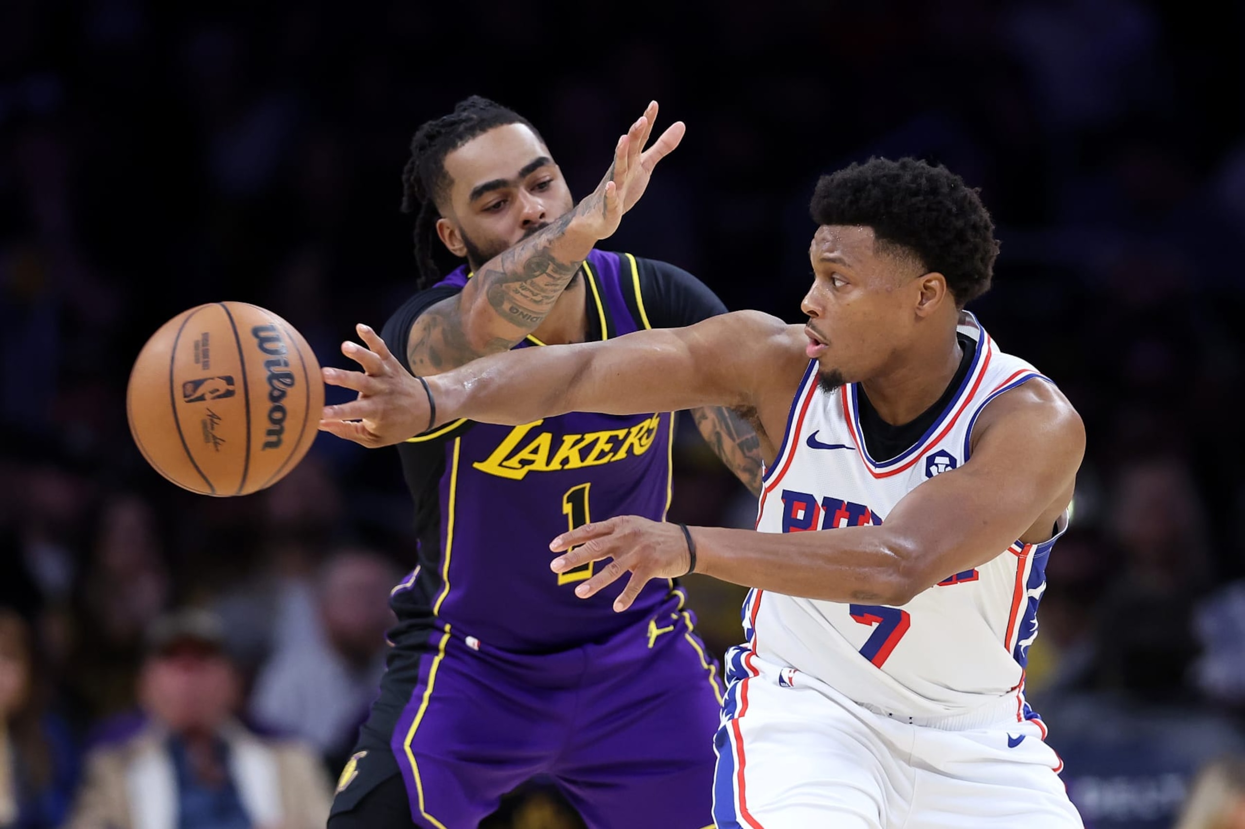 LOS ANGELES, CALIFORNIA - MARCH 22: D'Angelo Russell #1 of the Los Angeles Lakers defends against a pass by Kyle Lowry #7 of the Philadelphia 76ers during the second half of a game at Crypto.com Arena on March 22, 2024 in Los Angeles, California. NOTE TO USER: User expressly acknowledges and agrees that, by downloading and/or using this photograph, user is consenting to the terms and conditions of the Getty Images License Agreement. (Photo by Sean M. Haffey/Getty Images)