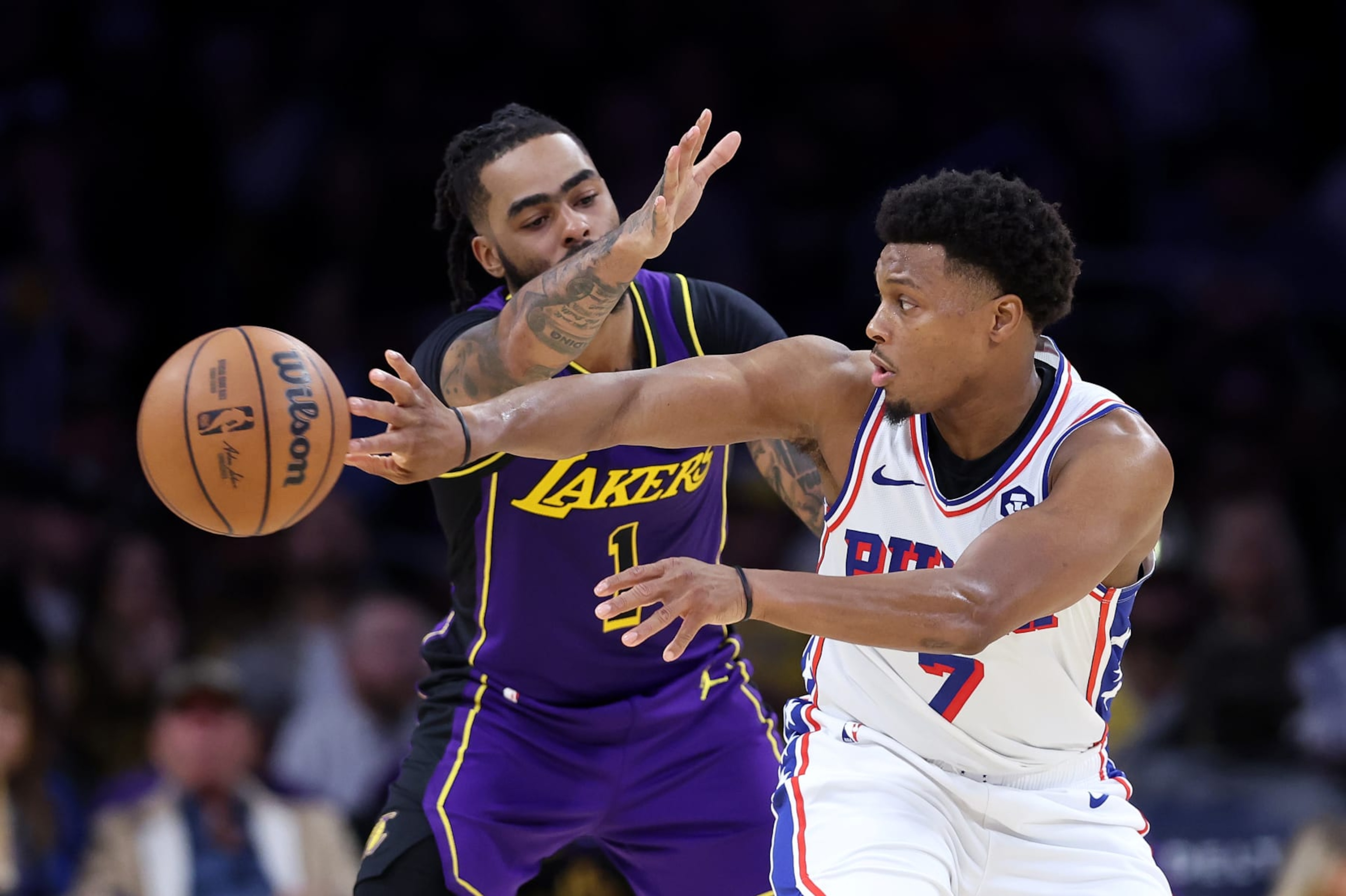 LOS ANGELES, CALIFORNIA - MARCH 22: D'Angelo Russell #1 of the Los Angeles Lakers defends against a pass by Kyle Lowry #7 of the Philadelphia 76ers during the second half of a game at Crypto.com Arena on March 22, 2024 in Los Angeles, California. NOTE TO USER: User expressly acknowledges and agrees that, by downloading and/or using this photograph, user is consenting to the terms and conditions of the Getty Images License Agreement. (Photo by Sean M. Haffey/Getty Images)