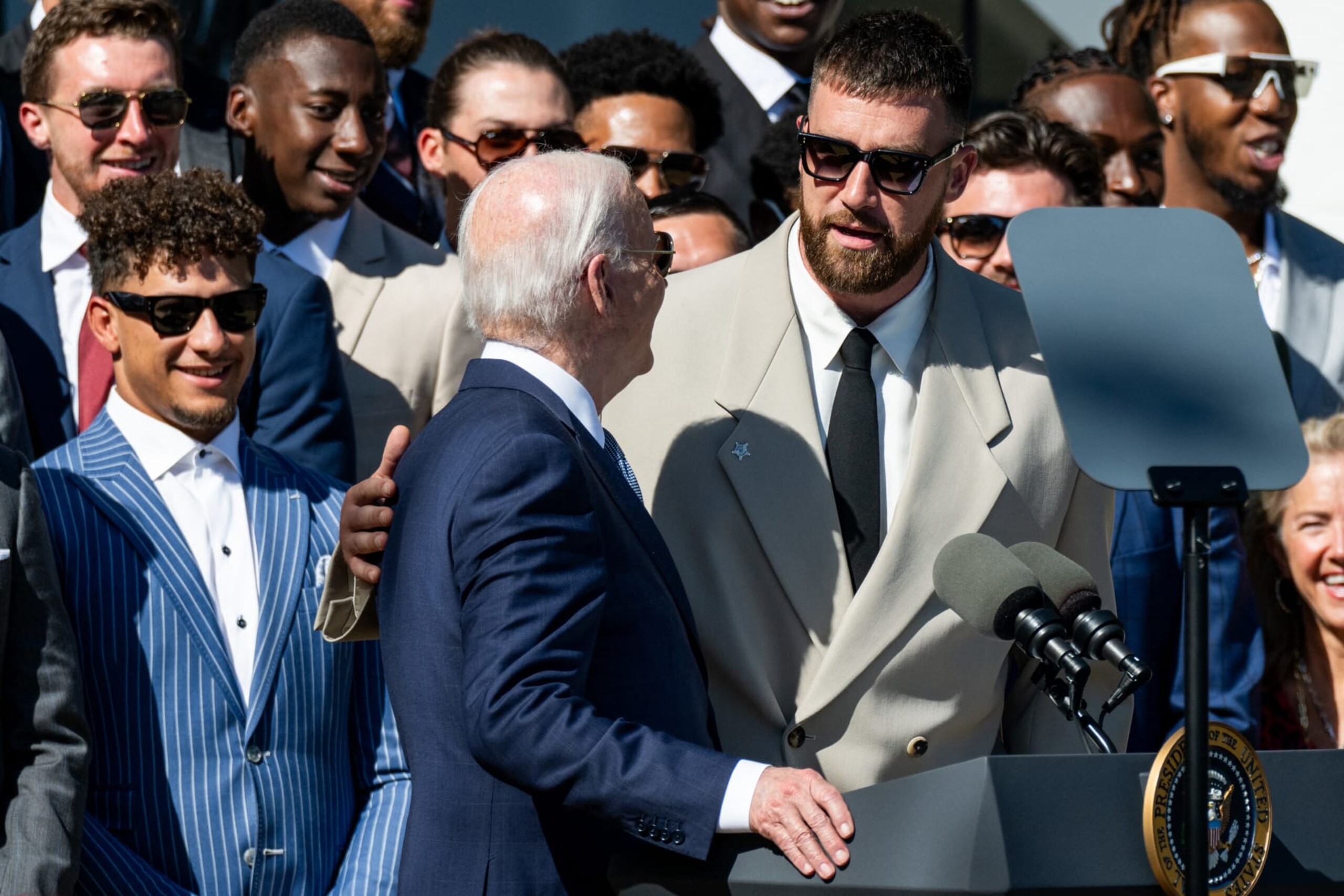 (From L) Kansas City Chiefs quarterback Patrick Mahomes looks on as US President Joe Biden speaks with Kansas City Chiefs tight end Travis Kelce during a celebration for the Kansas City Chiefs, 2024 Super Bowl champions, on the South Lawn of the White House in Washington, DC, on May 31, 2024. (Photo by SAUL LOEB / AFP) (Photo by SAUL LOEB/AFP via Getty Images) (From L) Kansas City Chiefs quarterback Patrick Mahomes looks on as US President Joe Biden speaks with Kansas City Chiefs tight end Travis Kelce during a celebration for the Kansas City Chiefs, 2024 Super Bowl champions, on the South Lawn of the White House in Washington, DC, on May 31, 2024. (Photo by SAUL LOEB / AFP) (Photo by SAUL LOEB/AFP via Getty Images)