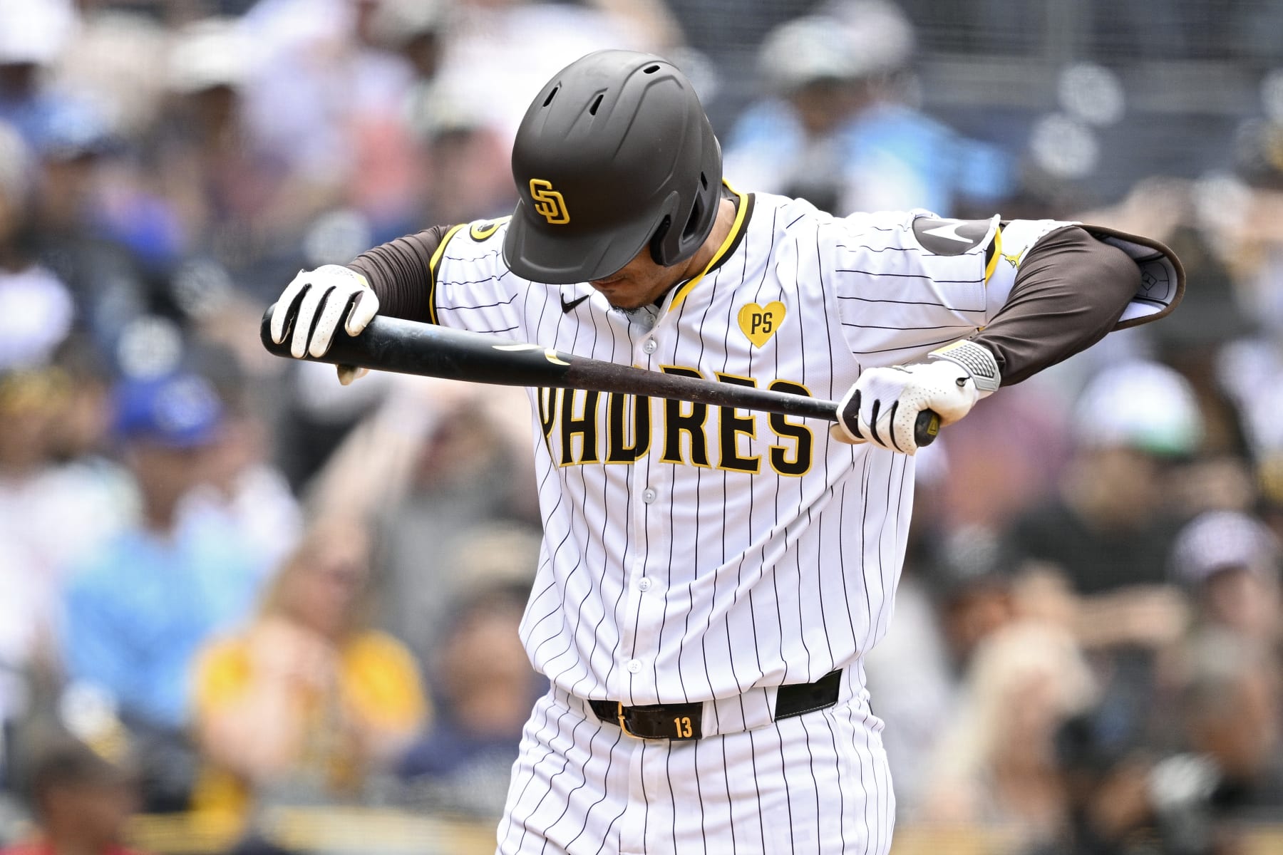 SAN DIEGO, CALIFORNIA - MAY 29: Manny Machado #13 of the San Diego Padres reacts after striking out during the third inning against the Miami Marlins at Petco Park on May 29, 2024 in San Diego, California. (Photo by Orlando Ramirez/Getty Images)