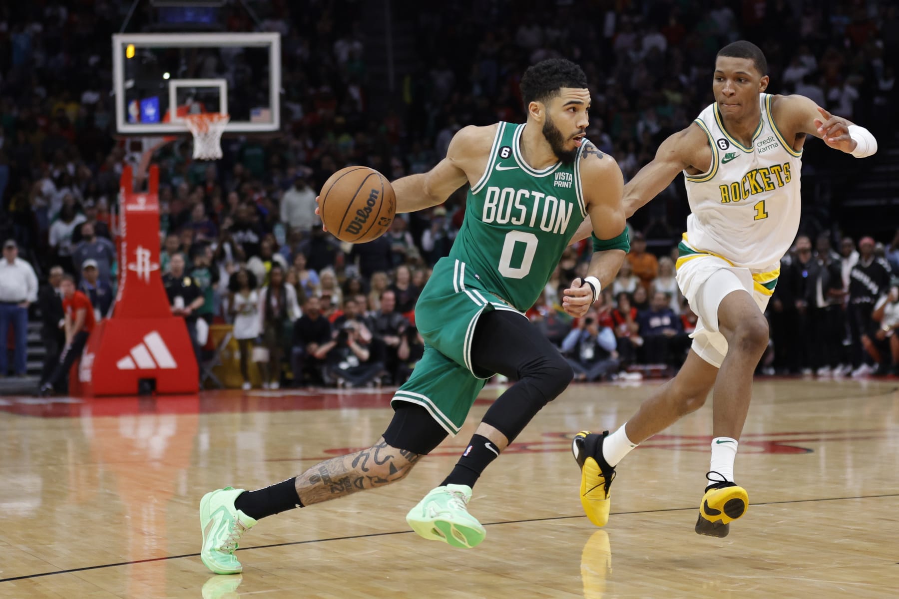 HOUSTON, TEXAS - MARCH 13: Jayson Tatum #0 of the Boston Celtics drives to the net ahead of Jabari Smith Jr. #1 of the Houston Rockets during the second half at Toyota Center on March 13, 2023 in Houston, Texas. NOTE TO USER: User expressly acknowledges and agrees that, by downloading and or using this photograph, User is consenting to the terms and conditions of the Getty Images License Agreement. (Photo by Carmen Mandato/Getty Images)