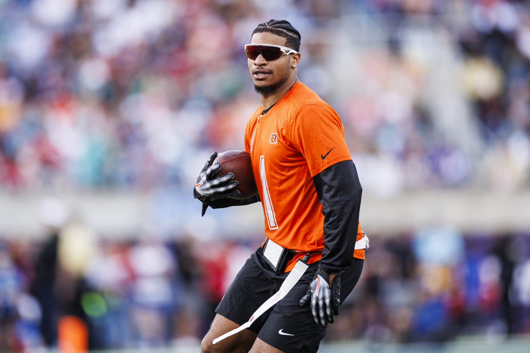 ORLANDO, FLORIDA - FEBRUARY 04:  Ja’Marr Chase #1 of the Cincinnati Bengals and AFC runs with the ball during the 2024 NFL Pro Bowl at Camping World Stadium on February 04, 2024 in Orlando, Florida. (Photo by James Gilbert/Getty Images)