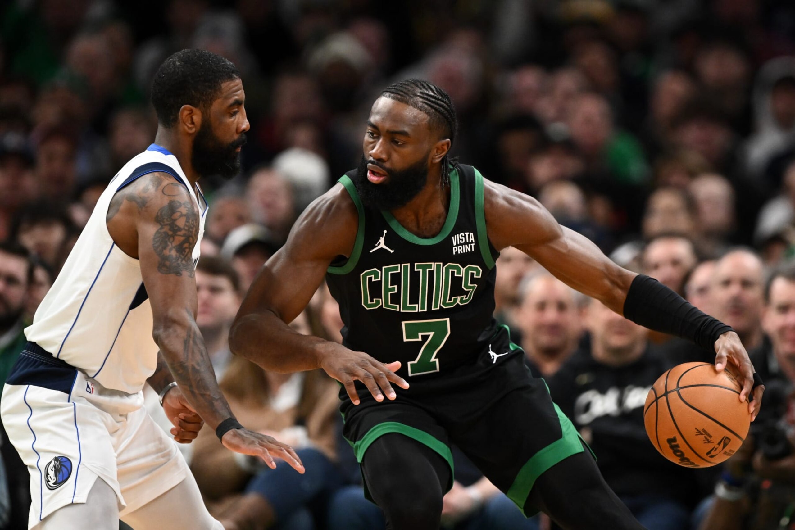 BOSTON, MASSACHUSETTS - MARCH 01: Jaylen Brown #7 of the Boston Celtics drives to the basket against Kyrie Irving #11 of the Dallas Mavericks during the first quarter at the TD Garden on March 01, 2024 in Boston, Massachusetts. NOTE TO USER: User expressly acknowledges and agrees that, by downloading and or using this photograph, User is consenting to the terms and conditions of the Getty Images License Agreement. (Photo by Brian Fluharty/Getty Images)