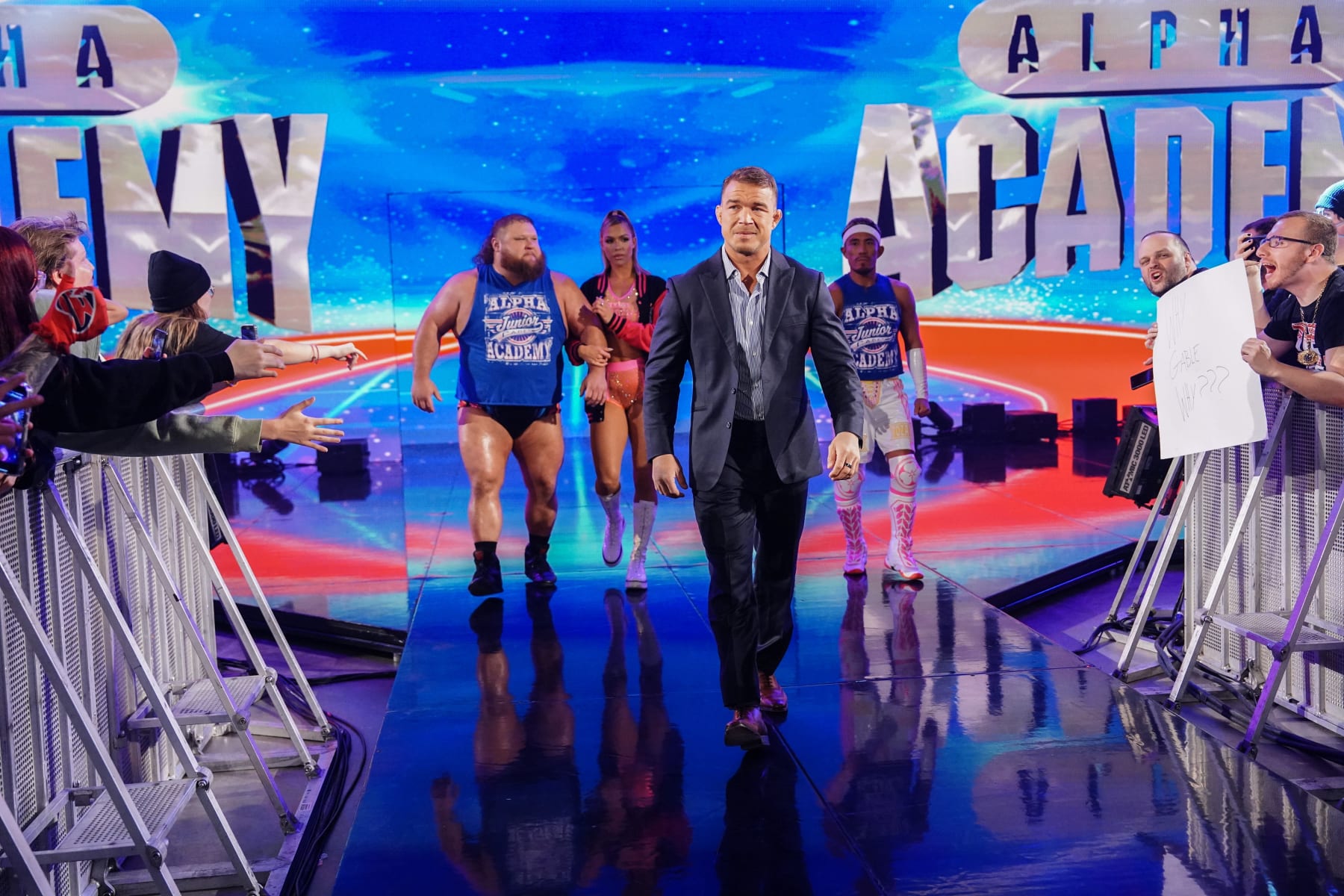 COLUMBUS, OHIO - APRIL 22: Chad Gable making his way to the ring with Otis, Maxxine Dupri, and Akira Tozawa of Alpha Academy during Monday Night RAW at Jerome Schottenstein Center on April 22, 2024 in Columbus, Ohio.  (Photo by WWE/Getty Images)