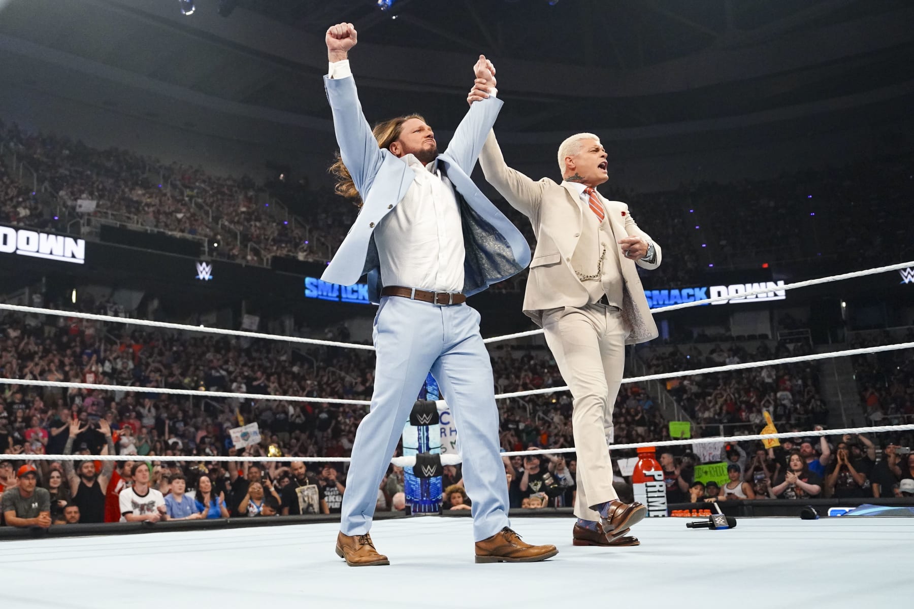 ALBANY, NEW YORK - MAY 31: AJ Styles and Cody Rhodes celebrate AJ styles passing off the Keys to the arena to Cody during SmackDown at MVP Arena on May 31, 2024 in Albany, New York.  (Photo by WWE/Getty Images)