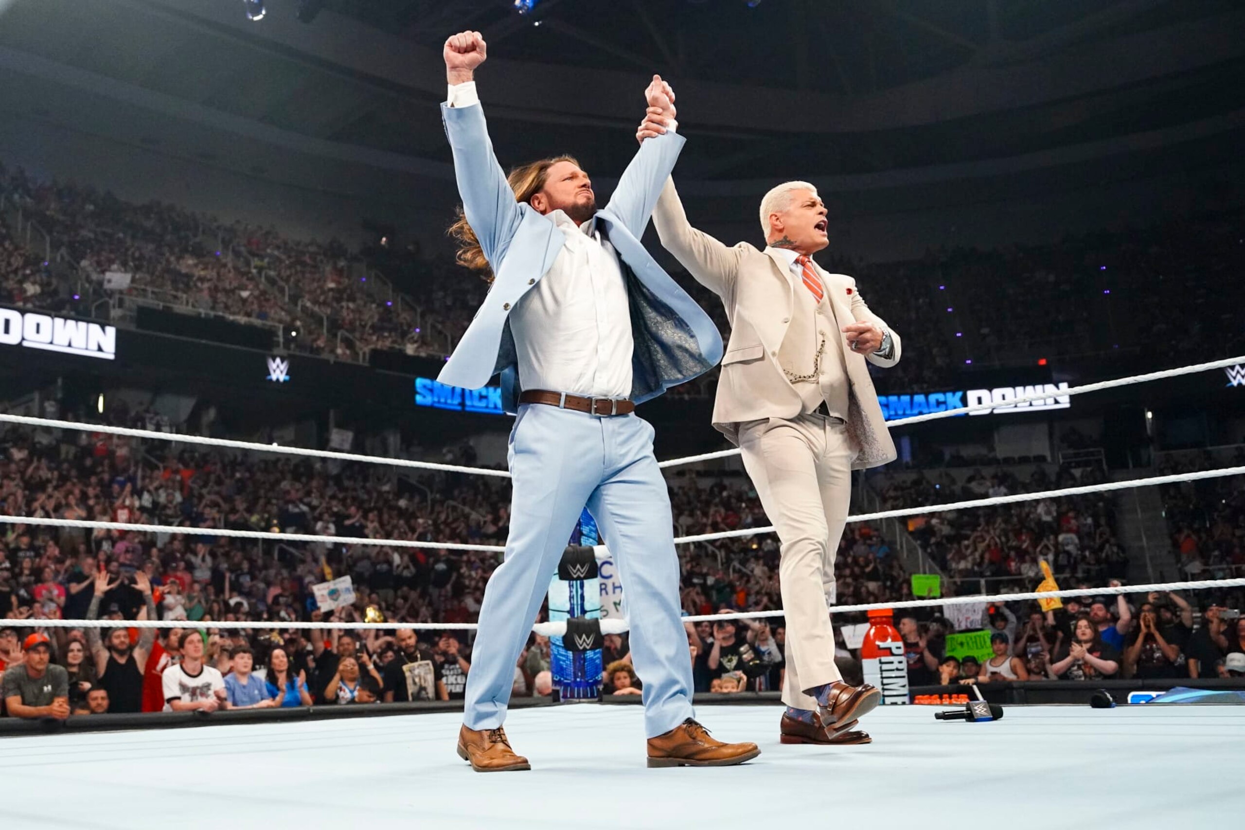 ALBANY, NEW YORK - MAY 31: AJ Styles and Cody Rhodes celebrate AJ styles passing off the Keys to the arena to Cody during SmackDown at MVP Arena on May 31, 2024 in Albany, New York.  (Photo by WWE/Getty Images)