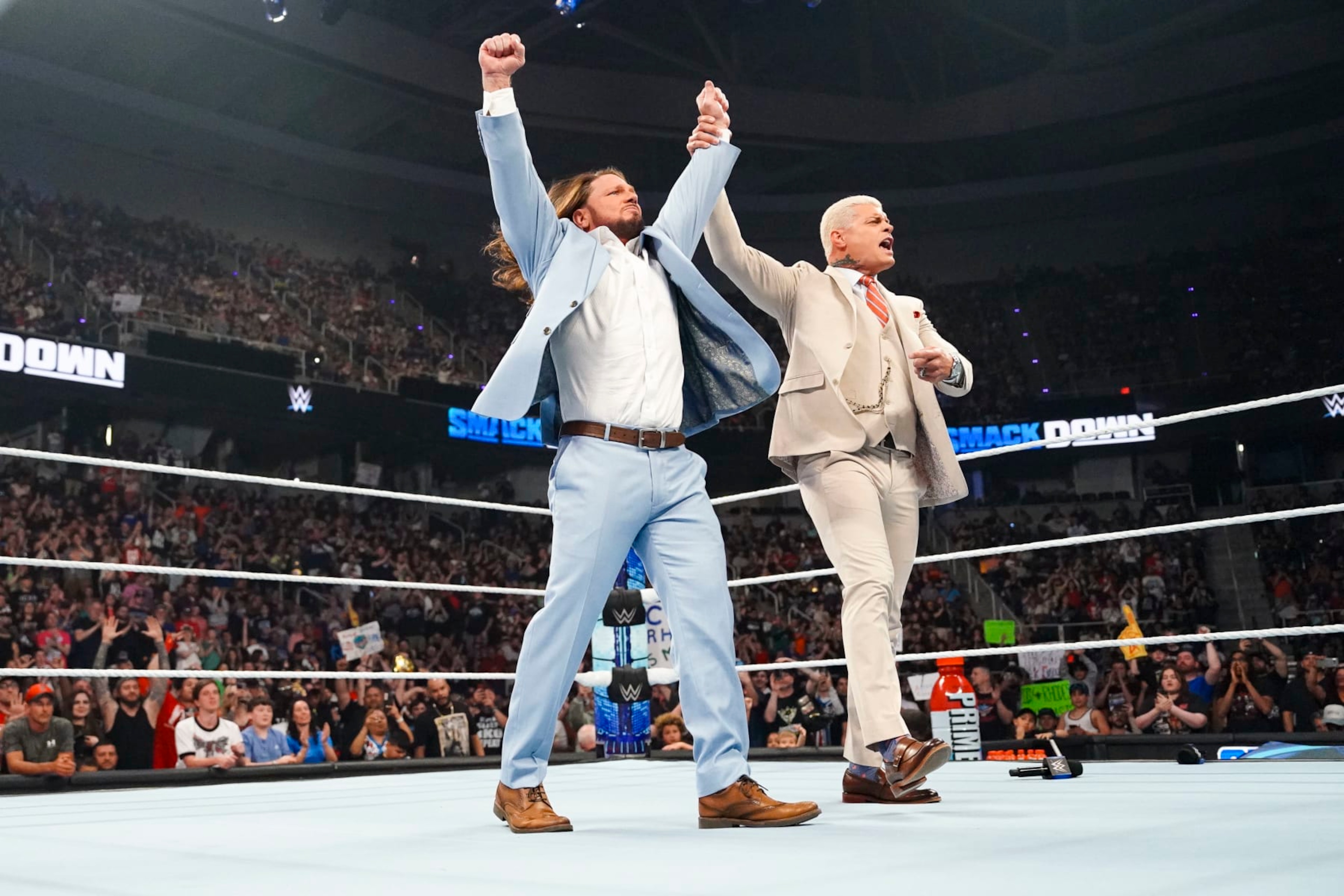 ALBANY, NEW YORK - MAY 31: AJ Styles and Cody Rhodes celebrate AJ styles passing off the Keys to the arena to Cody during SmackDown at MVP Arena on May 31, 2024 in Albany, New York.  (Photo by WWE/Getty Images)