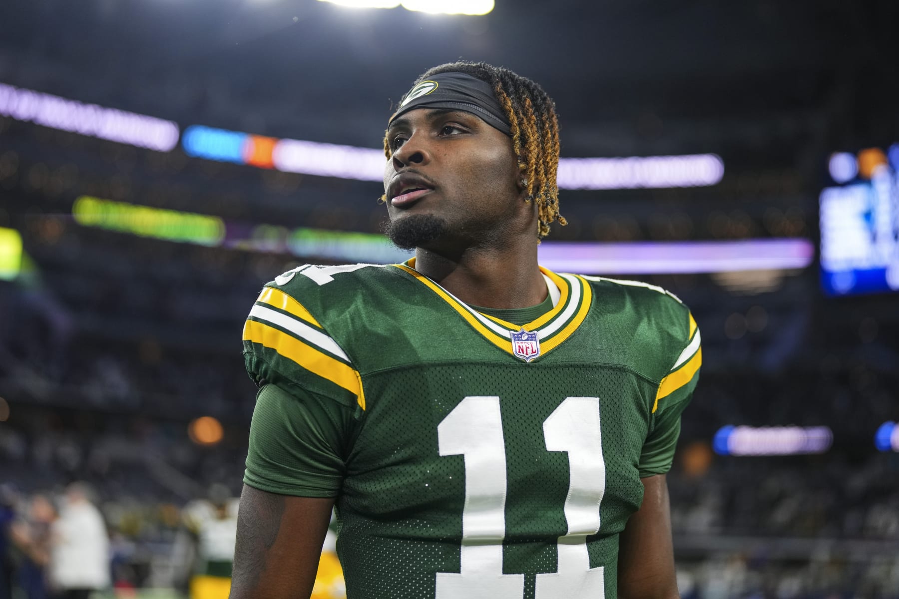 DALLAS, TX - JANUARY 14: Jayden Reed #11 of the Green Bay Packers looks on from the field after an NFL wild-card playoff football game against the Dallas Cowboys at AT&T Stadium on January 14, 2024 in Dallas, Texas. (Photo by Cooper Neill/Getty Images)