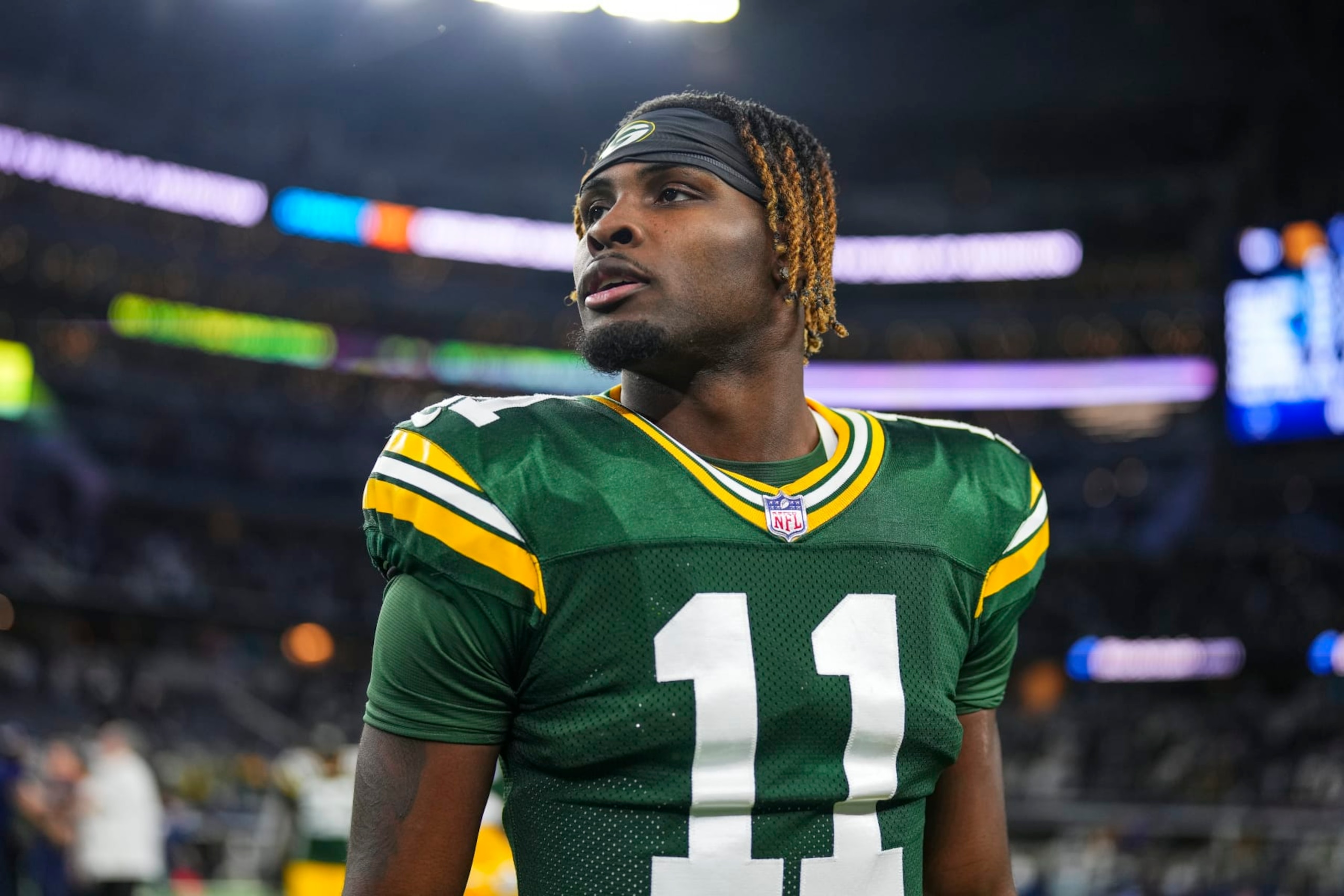 DALLAS, TX - JANUARY 14: Jayden Reed #11 of the Green Bay Packers looks on from the field after an NFL wild-card playoff football game against the Dallas Cowboys at AT&T Stadium on January 14, 2024 in Dallas, Texas. (Photo by Cooper Neill/Getty Images)