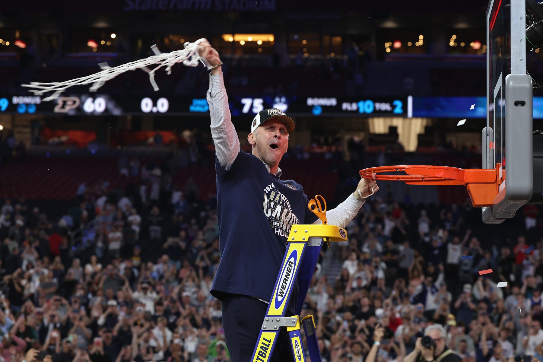 GLENDALE, ARIZONA - APRIL 08: Head coach Dan Hurley of the Connecticut Huskies cuts down the net after beating the Purdue Boilermakers 75-60 to win the NCAA Men's Basketball Tournament National Championship game at State Farm Stadium on April 08, 2024 in Glendale, Arizona. (Photo by Christian Petersen/Getty Images)