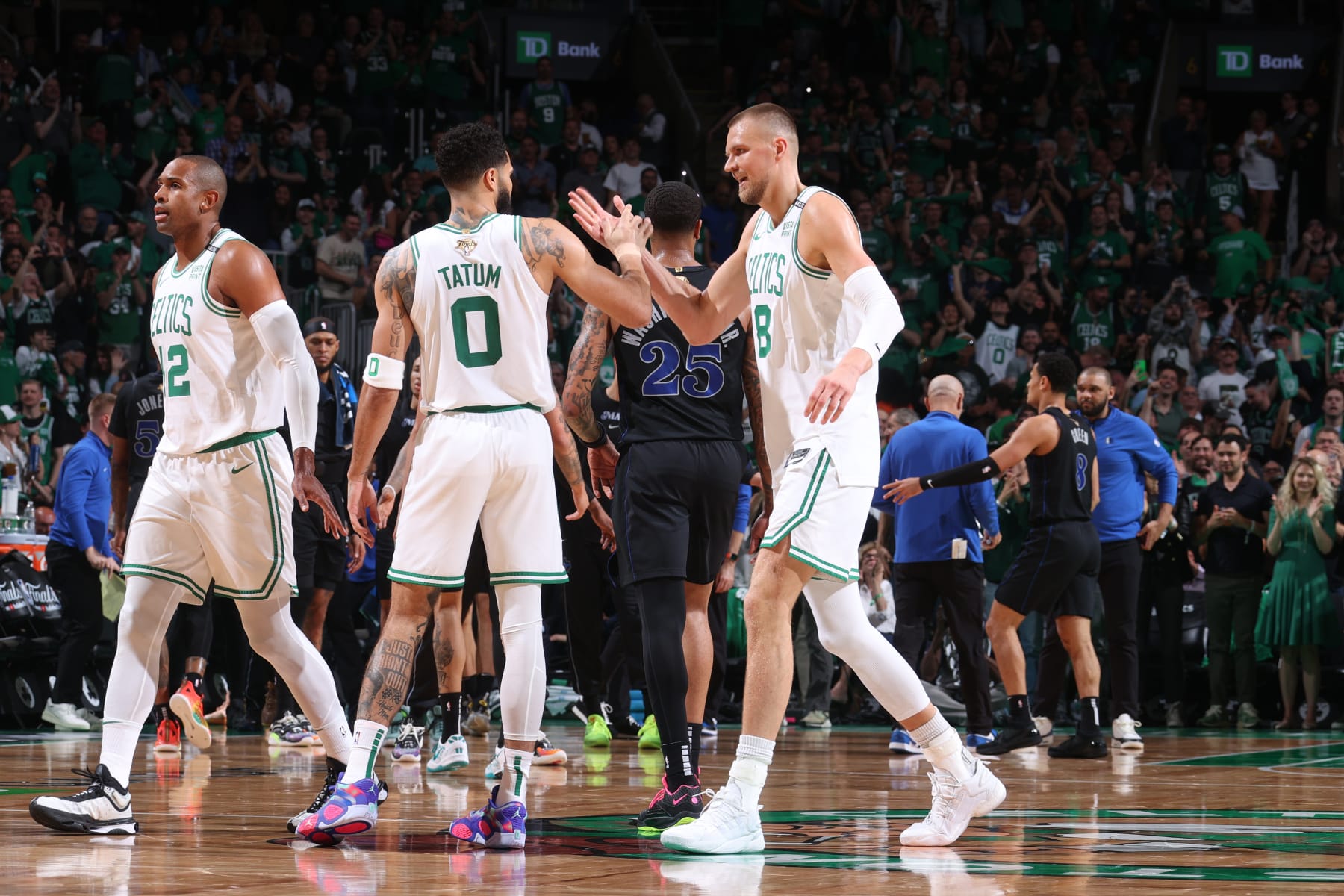 Al Horford, Jayson Tatum and Kristaps PorziÅÄ£is