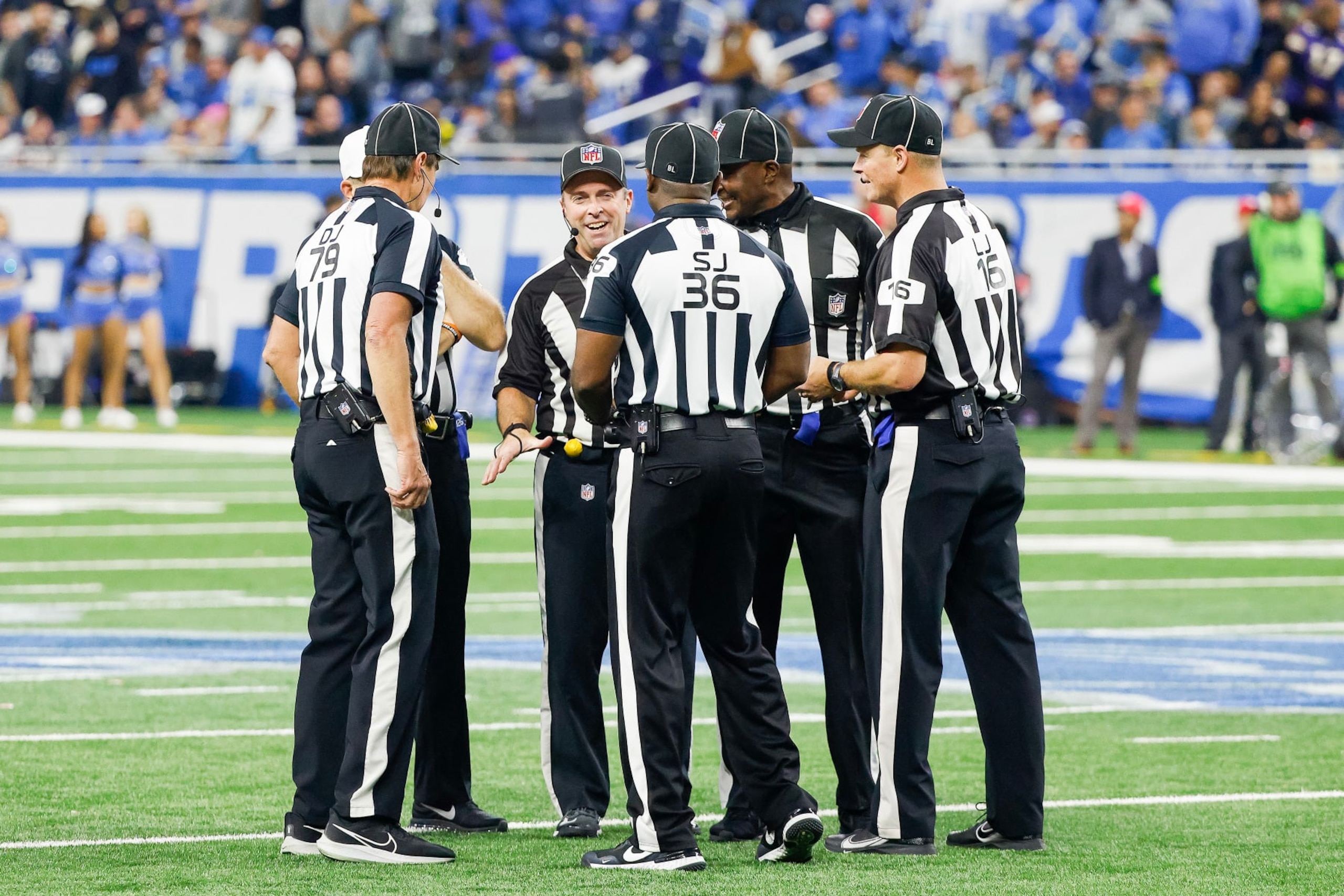 DETROIT, MICHIGAN - JANUARY 07: The referee crew talks during a timeout in the second half of a game between the Minnesota Vikings and the Detroit Lions at Ford Field on January 07, 2024 in Detroit, Michigan. (Photo by Mike Mulholland/Getty Images)