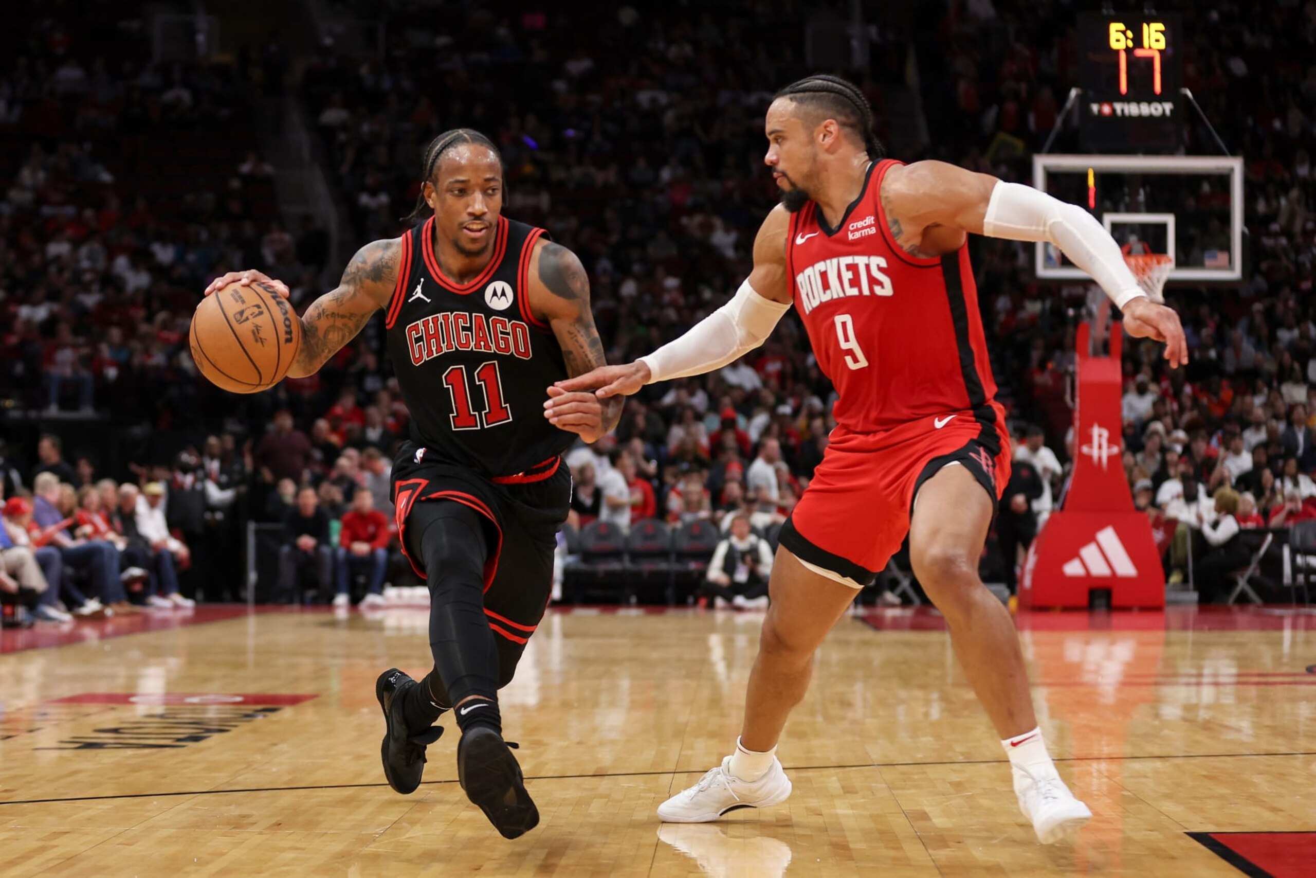 HOUSTON, TEXAS - MARCH 21: DeMar DeRozan #11 of the Chicago Bulls drives to the basket against Dillon Brooks #9 of the Houston Rockets in the second half at Toyota Center on March 21, 2024 in Houston, Texas.  NOTE TO USER: User expressly acknowledges and agrees that, by downloading and or using this photograph, User is consenting to the terms and conditions of the Getty Images License Agreement. (Photo by Tim Warner/Getty Images)
