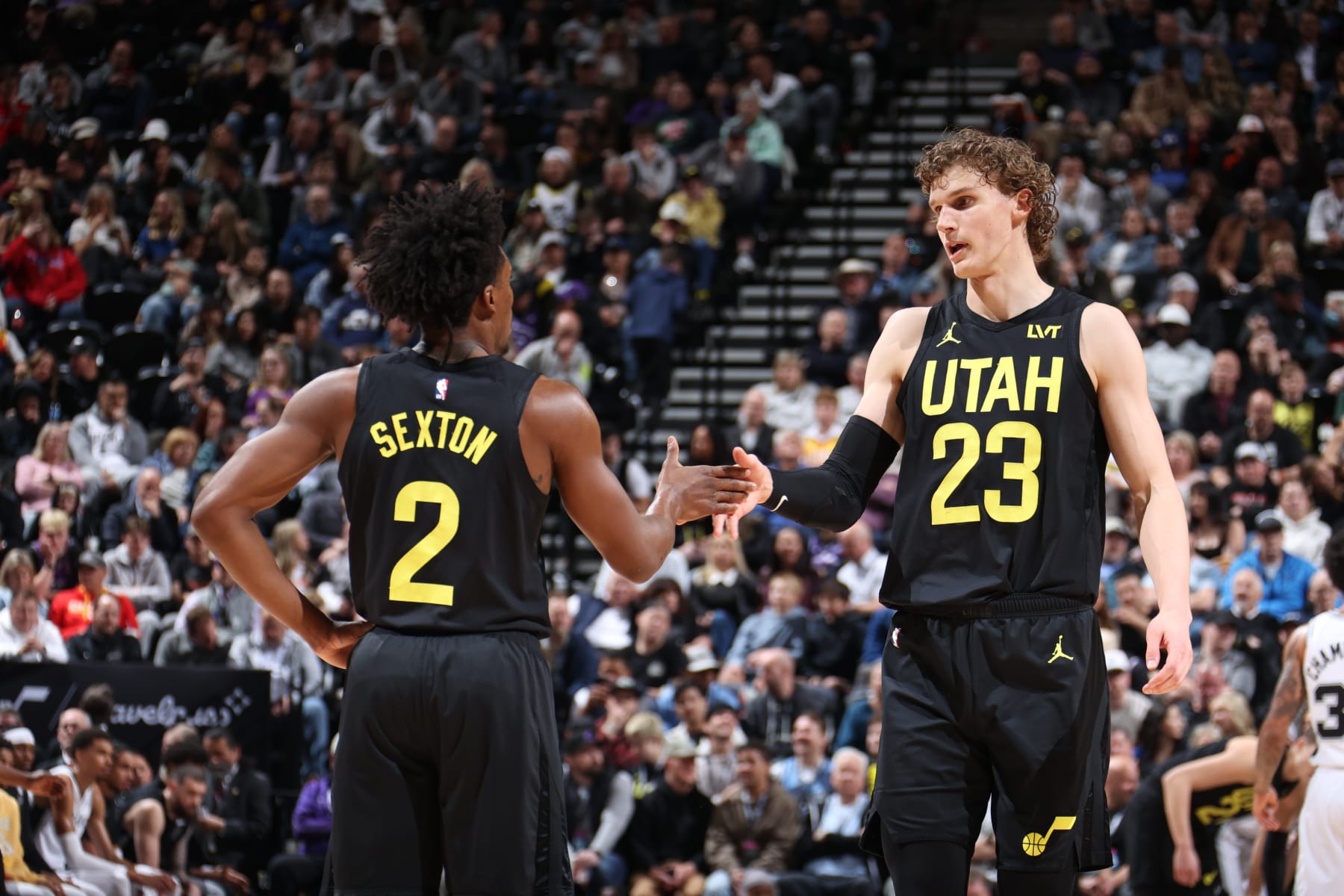 SALT LAKE CITY, UT - MARCH 27: Lauri Markkanen #23 of the Utah Jazz high fives Colin Sexton #2 during the game against the San Antonio Spurs on March 27, 2024 at Delta Center in Salt Lake City, Utah. NOTE TO USER: User expressly acknowledges and agrees that, by downloading and or using this Photograph, User is consenting to the terms and conditions of the Getty Images License Agreement. Mandatory Copyright Notice: Copyright 2024 NBAE (Photo by Melissa Majchrzak/NBAE via Getty Images)