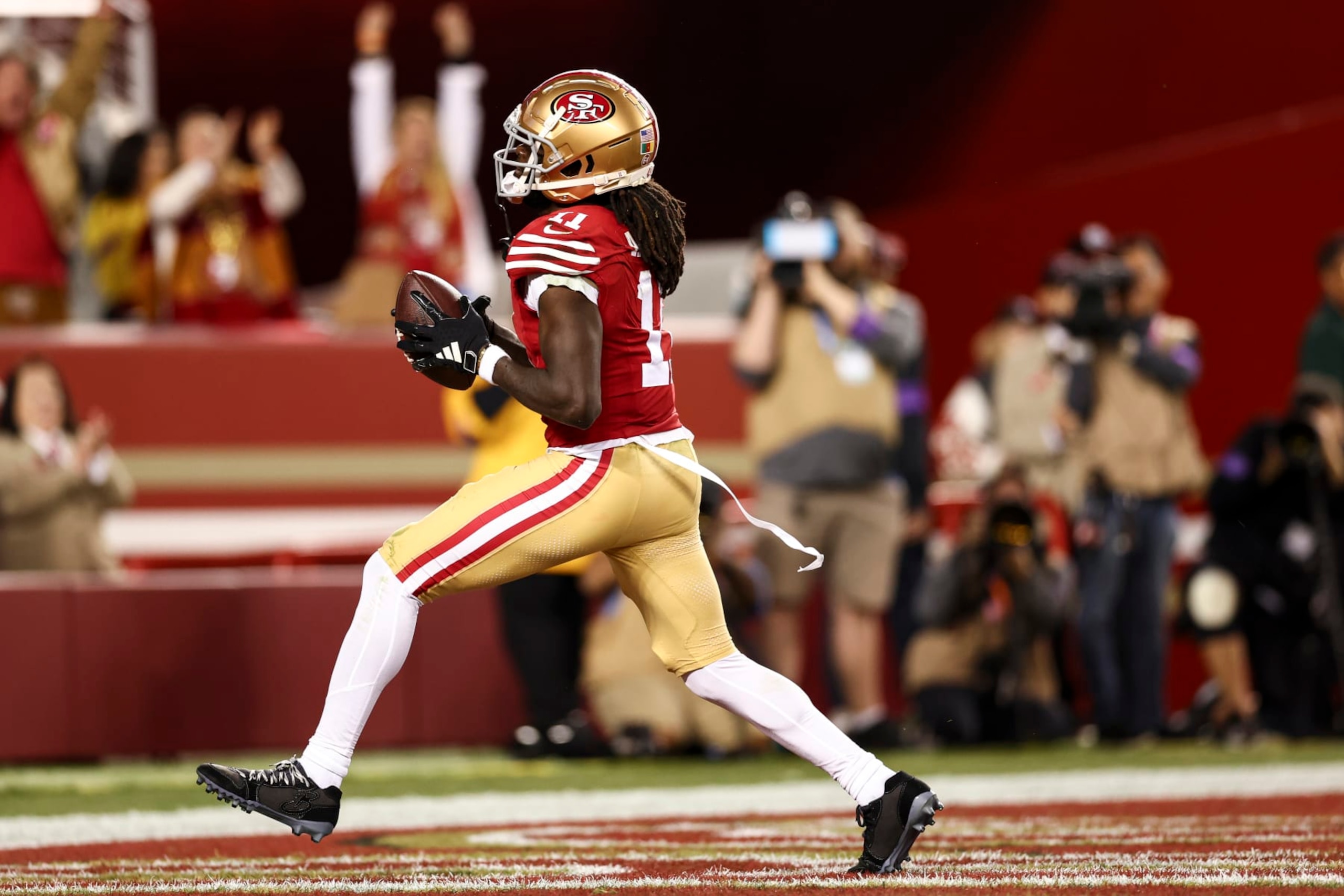 SANTA CLARA, CA - JANUARY 28: Brandon Aiyuk #11 of the San Francisco 49ers celebrates after a diving catch during the NFC Championship NFL football game against the Detroit Lions at Levi's Stadium on January 28, 2024 in Santa Clara, California. (Photo by Kevin Sabitus/Getty Images) SANTA CLARA, CA - JANUARY 28: Brandon Aiyuk #11 of the San Francisco 49ers celebrates after a diving catch during the NFC Championship NFL football game against the Detroit Lions at Levi's Stadium on January 28, 2024 in Santa Clara, California. (Photo by Kevin Sabitus/Getty Images)