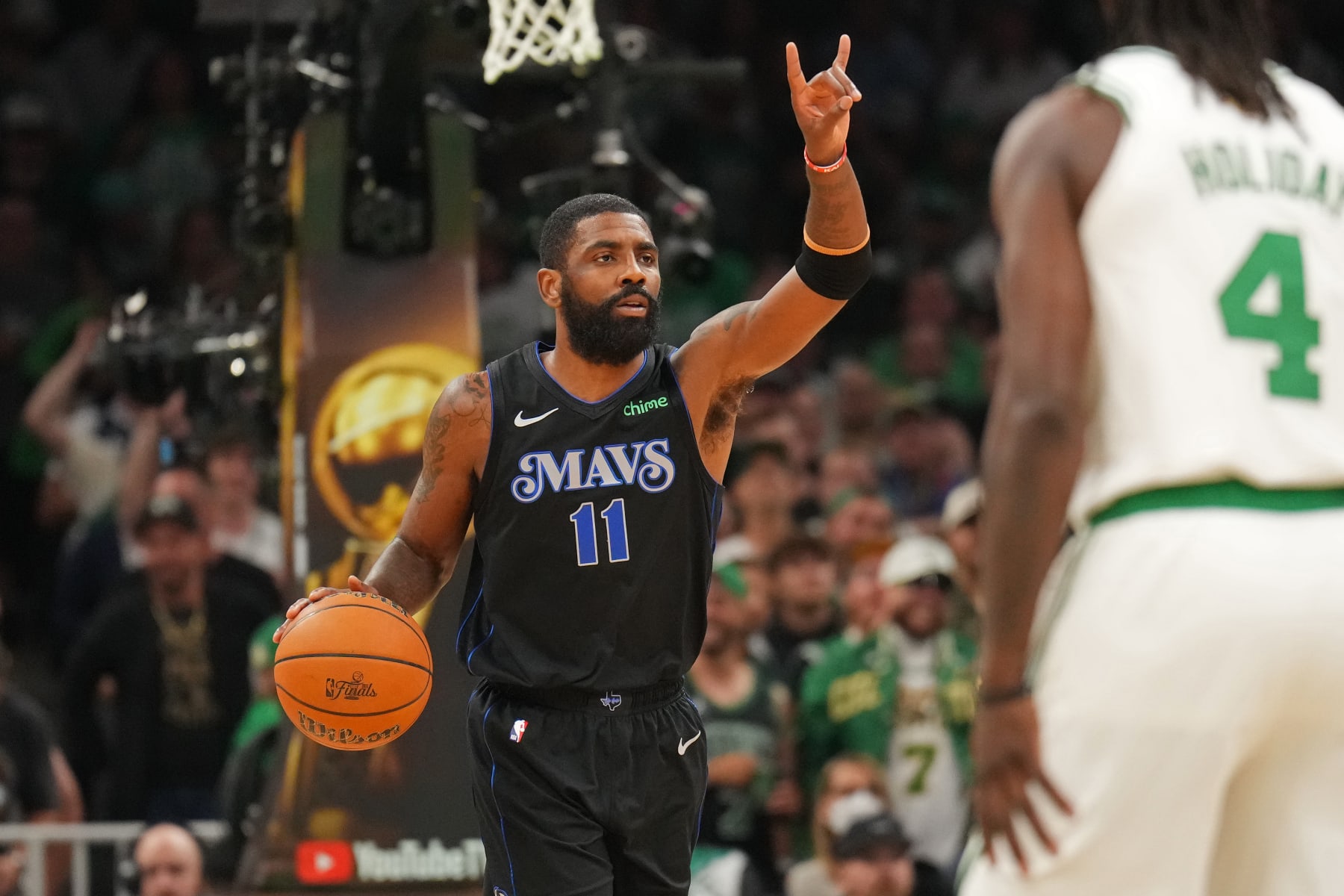 BOSTON, MA - JUNE 6: Kyrie Irving #11 of the Dallas Mavericks handles the ball during the game against the Boston Celtics during Game 1 of the 2024 NBA Finals on June 6, 2024 at the TD Garden in Boston, Massachusetts. NOTE TO USER: User expressly acknowledges and agrees that, by downloading and or using this photograph, User is consenting to the terms and conditions of the Getty Images License Agreement. Mandatory Copyright Notice: Copyright 2024 NBAE  (Photo by Jesse D. Garrabrant/NBAE via Getty Images)