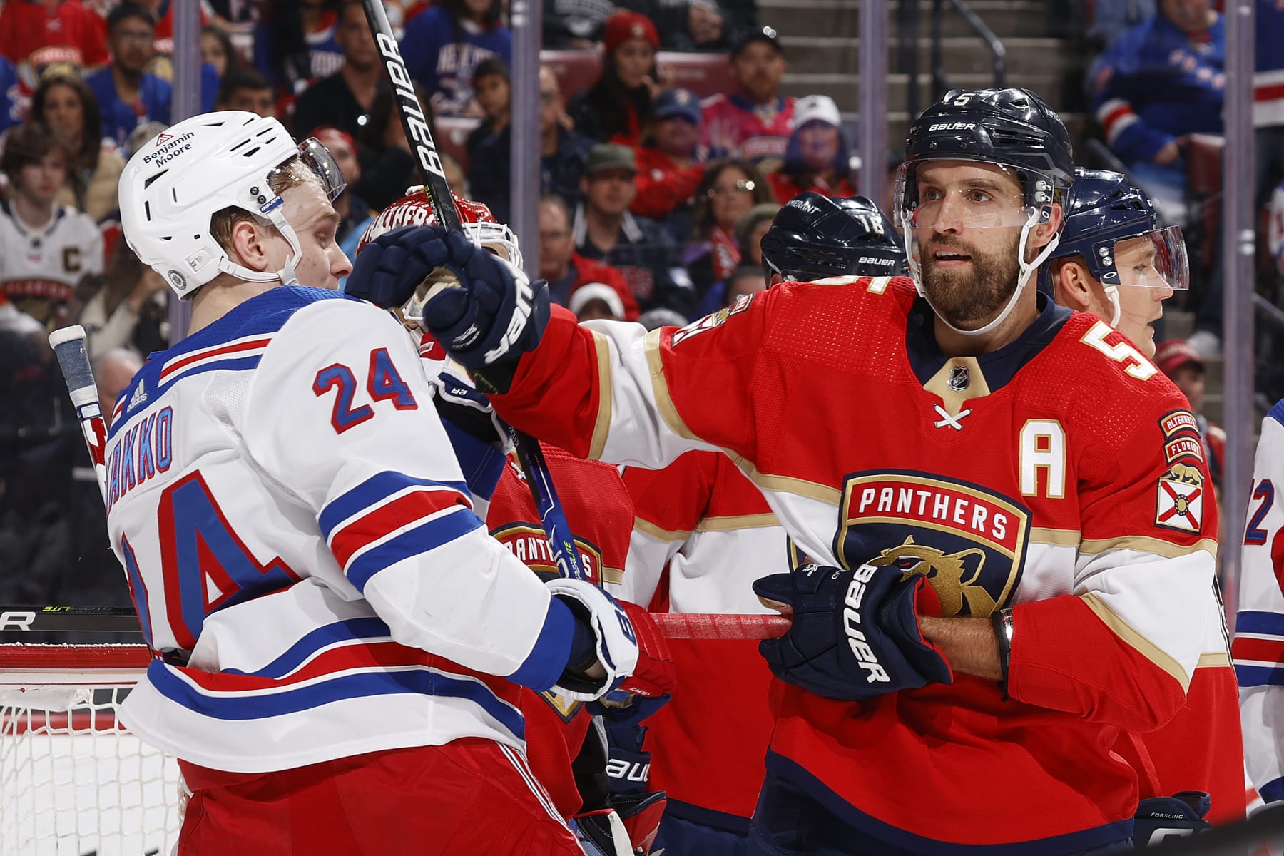 Florida Panthers defenseman Aaron Ekblad (right) and New York Rangers winger Kaapo Kakko. 