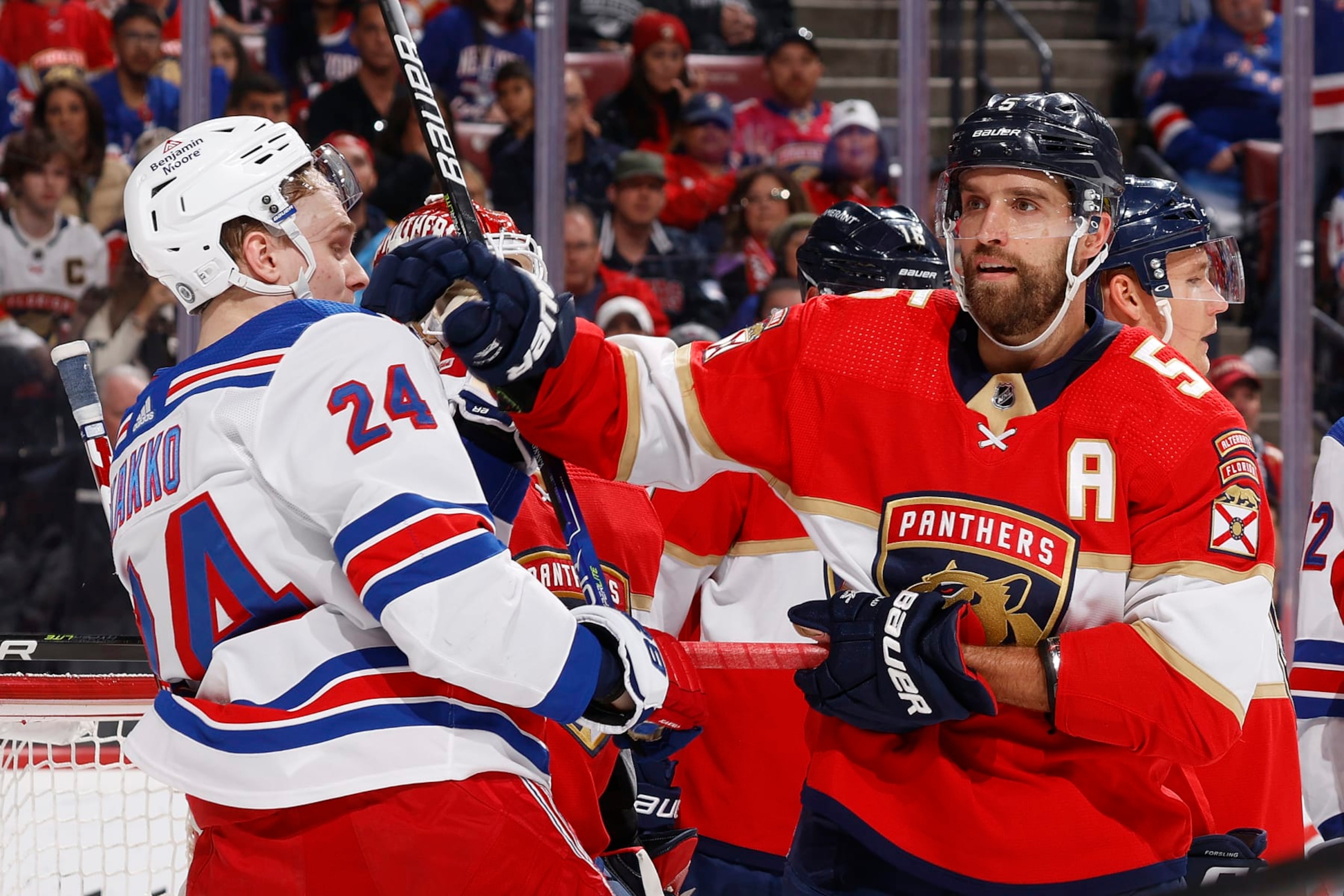 Florida Panthers defenseman Aaron Ekblad (right) and New York Rangers winger Kaapo Kakko. 