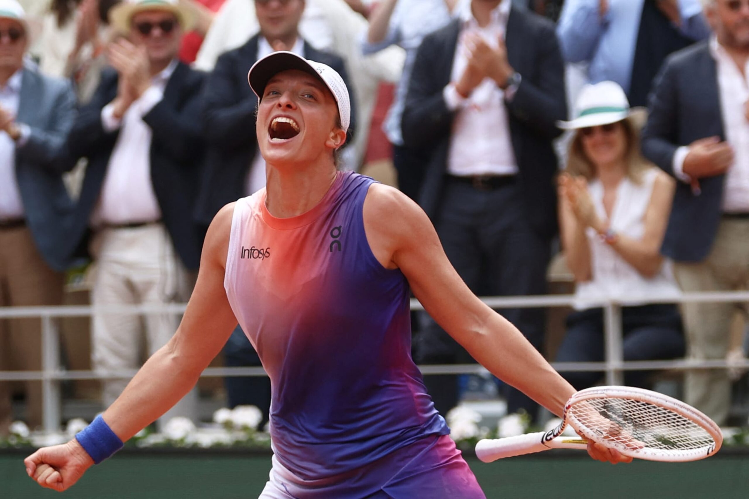 TOPSHOT - Poland's Iga Swiatek celebrates her victory over Italy's Jasmine Paolini after their women's singles final match on Court Philippe-Chatrier on day fourteen of the French Open tennis tournament at the Roland Garros Complex in Paris on June 8, 2024. (Photo by Emmanuel Dunand / AFP) (Photo by EMMANUEL DUNAND/AFP via Getty Images)