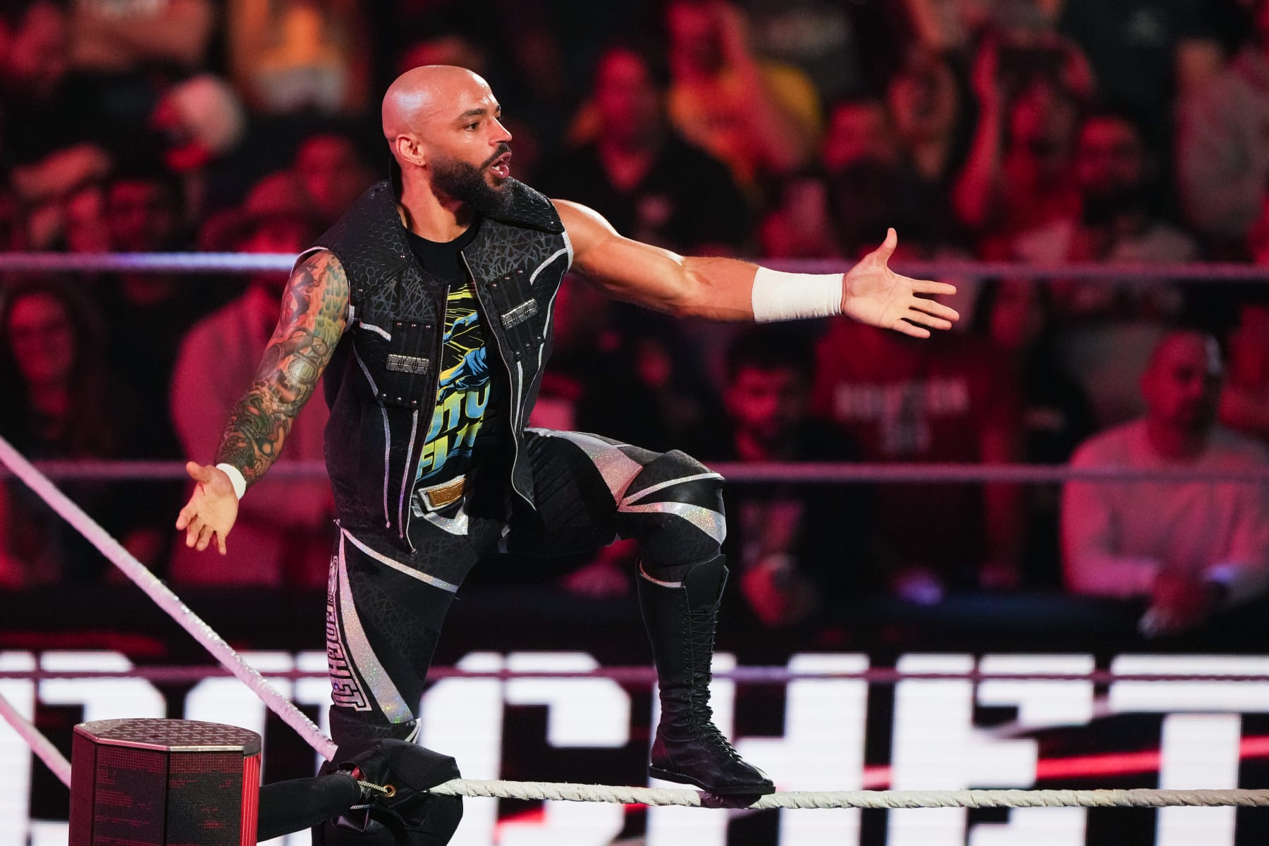 HOUSTON, TEXAS - MARCH 11: Ricochet is introduced prior to his match during WWE Monday Night RAW at Toyota Center on March 11, 2024 in Houston, Texas. (Photo by Alex Bierens de Haan/Getty Images)