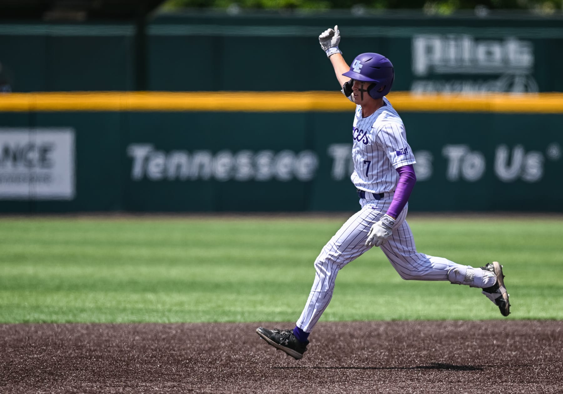 KNOXVILLE, TN - JUNE 07: Evansville infielder Cal McGinnis (7) celebrates a home run during the NCAA Men's Baseball Super Regional game between the Tennessee Volunteers and the Evansville Aces on June 8, 2024, at Lindsey Nelson Stadium in Knoxville, TN. (Photo by Bryan Lynn/Icon Sportswire via Getty Images)