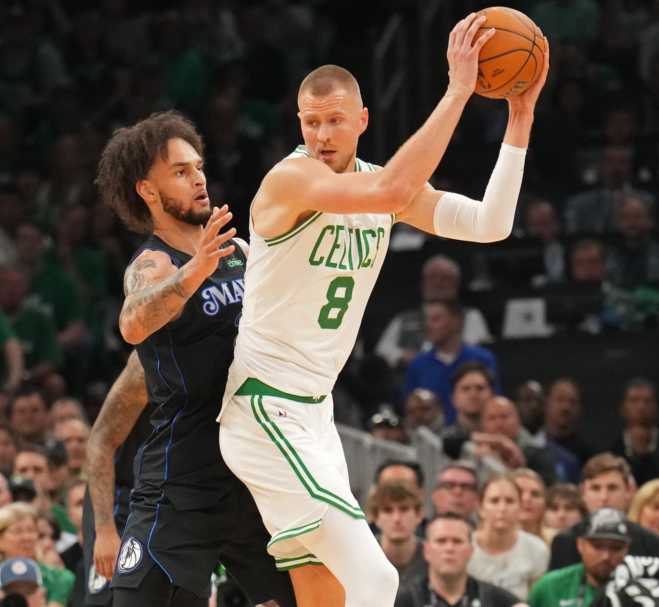 BOSTON, MA - JUNE 6: Kristaps Porzingis #8 of the Boston Celtics handles the ball during the game against the Dallas Mavericks during Game 1 of the 2024 NBA Finals on June 6, 2024 at the TD Garden in Boston, Massachusetts. NOTE TO USER: User expressly acknowledges and agrees that, by downloading and or using this photograph, User is consenting to the terms and conditions of the Getty Images License Agreement. Mandatory Copyright Notice: Copyright 2024 NBAE  (Photo by Jesse D. Garrabrant/NBAE via Getty Images)