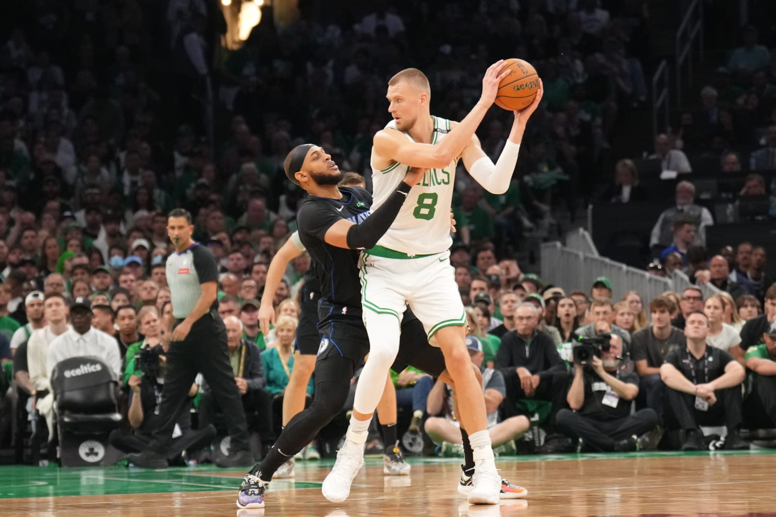 BOSTON, MA - JUNE 6: Kristaps Porzingis #8 of the Boston Celtics looks to pass the ball during the game against the Dallas Mavericks during Game 1 of the 2024 NBA Finals on June 6, 2024 at the TD Garden in Boston, Massachusetts. NOTE TO USER: User expressly acknowledges and agrees that, by downloading and or using this photograph, User is consenting to the terms and conditions of the Getty Images License Agreement. Mandatory Copyright Notice: Copyright 2024 NBAE  (Photo by Jesse D. Garrabrant/NBAE via Getty Images)