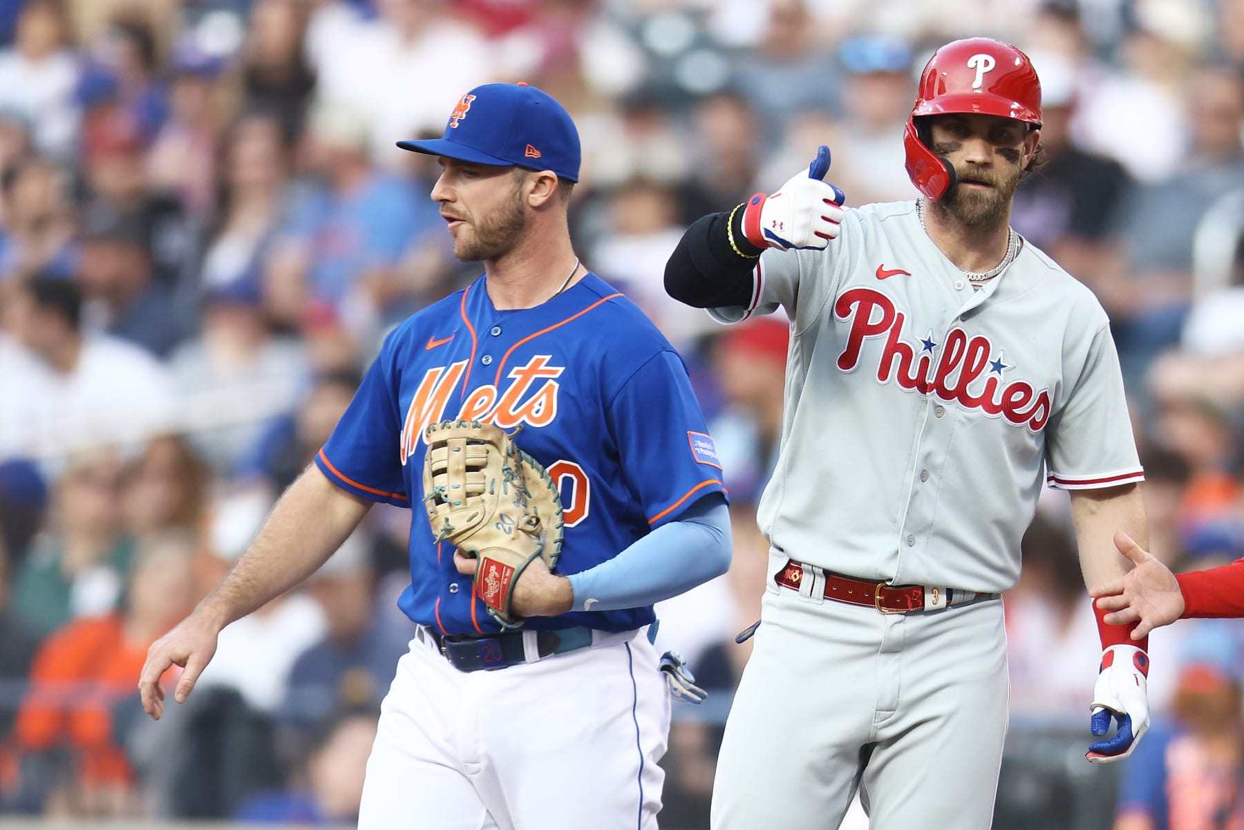 NEW YORK, NEW YORK - MAY 31: Bryce Harper #3 of the Philadelphia Phillies reacts after hitting a first inning single as Pete Alonso #20 of the New York Mets looks on at Citi Field on May 31, 2023 in New York City. (Photo by Mike Stobe/Getty Images)