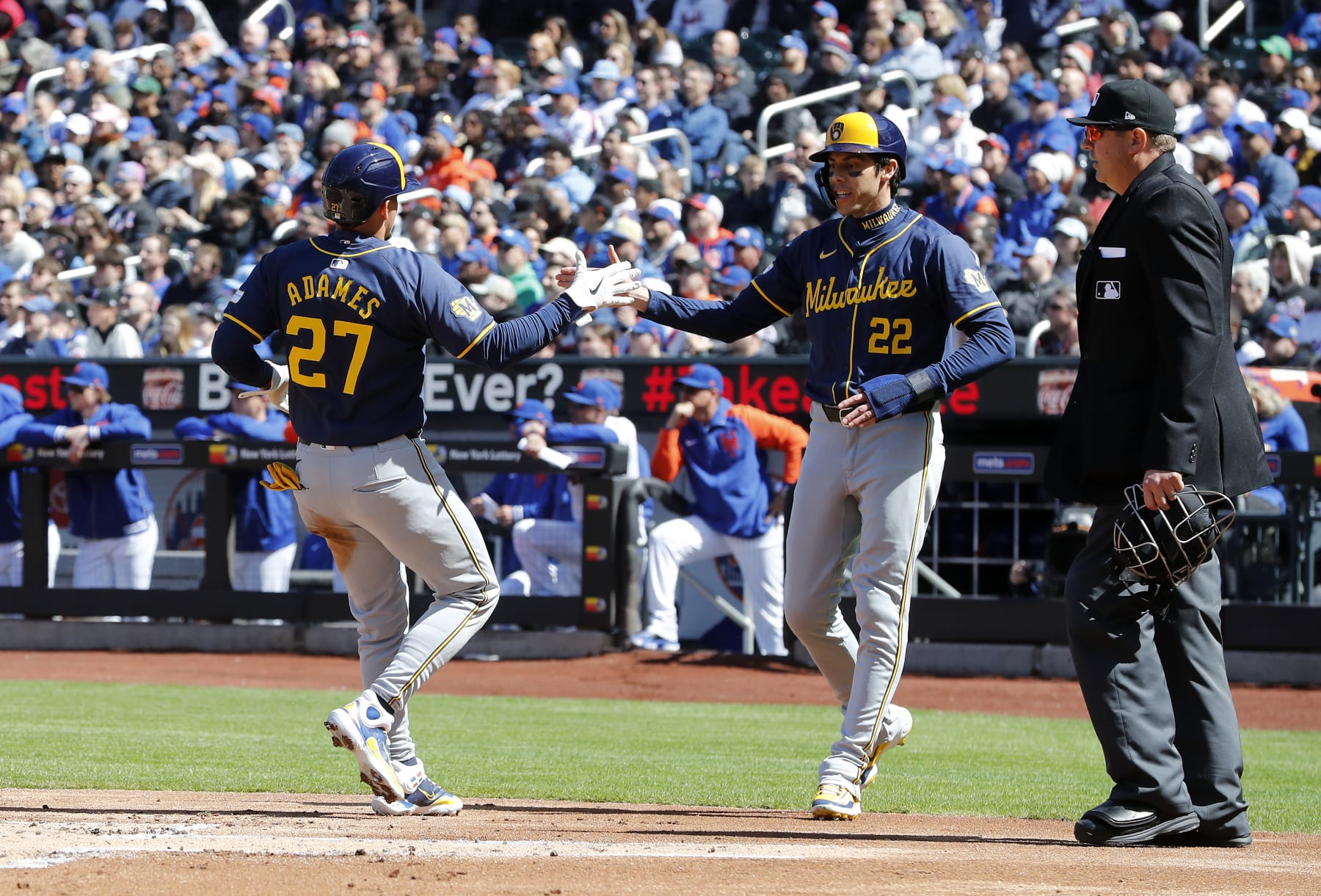 NEW YORK, NEW YORK - MARCH 30: (NEW YORK DAILIES OUT)  Christian Yelich #22 and Willy Adames #27 of the Milwaukee Brewers celebrate scoring during the first inning against the New York Mets at Citi Field on March 30, 2024 in New York City. The Brewers defeated the Mets 7-6. (Photo by Jim McIsaac/Getty Images)