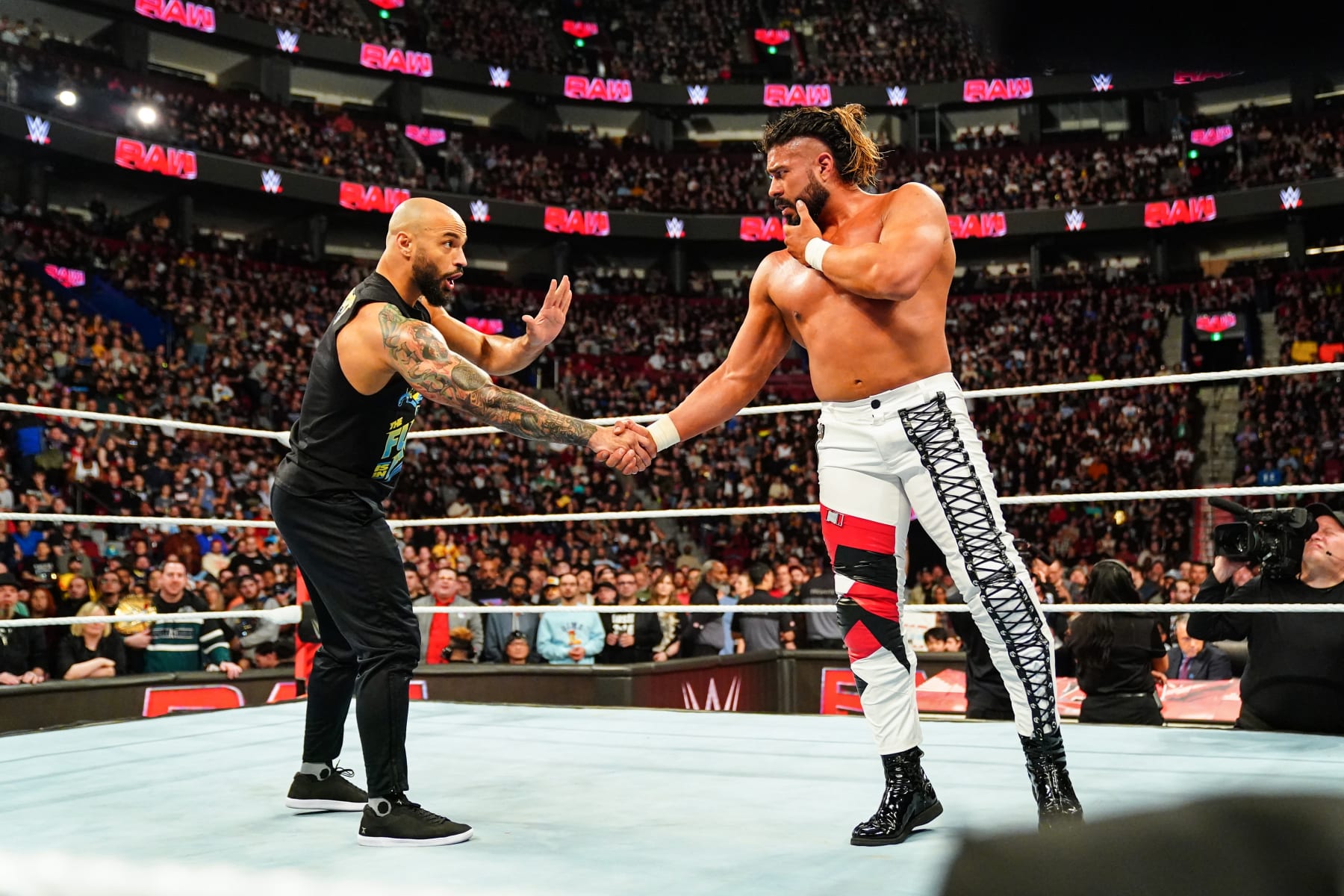 MONTREAL, CANADA - APRIL 15: Ricochet makes the save for Andrade during Monday Night RAW at the Bell Centre on April 15, 2024 in Montreal, Canada.  (Photo by WWE/Getty Images)