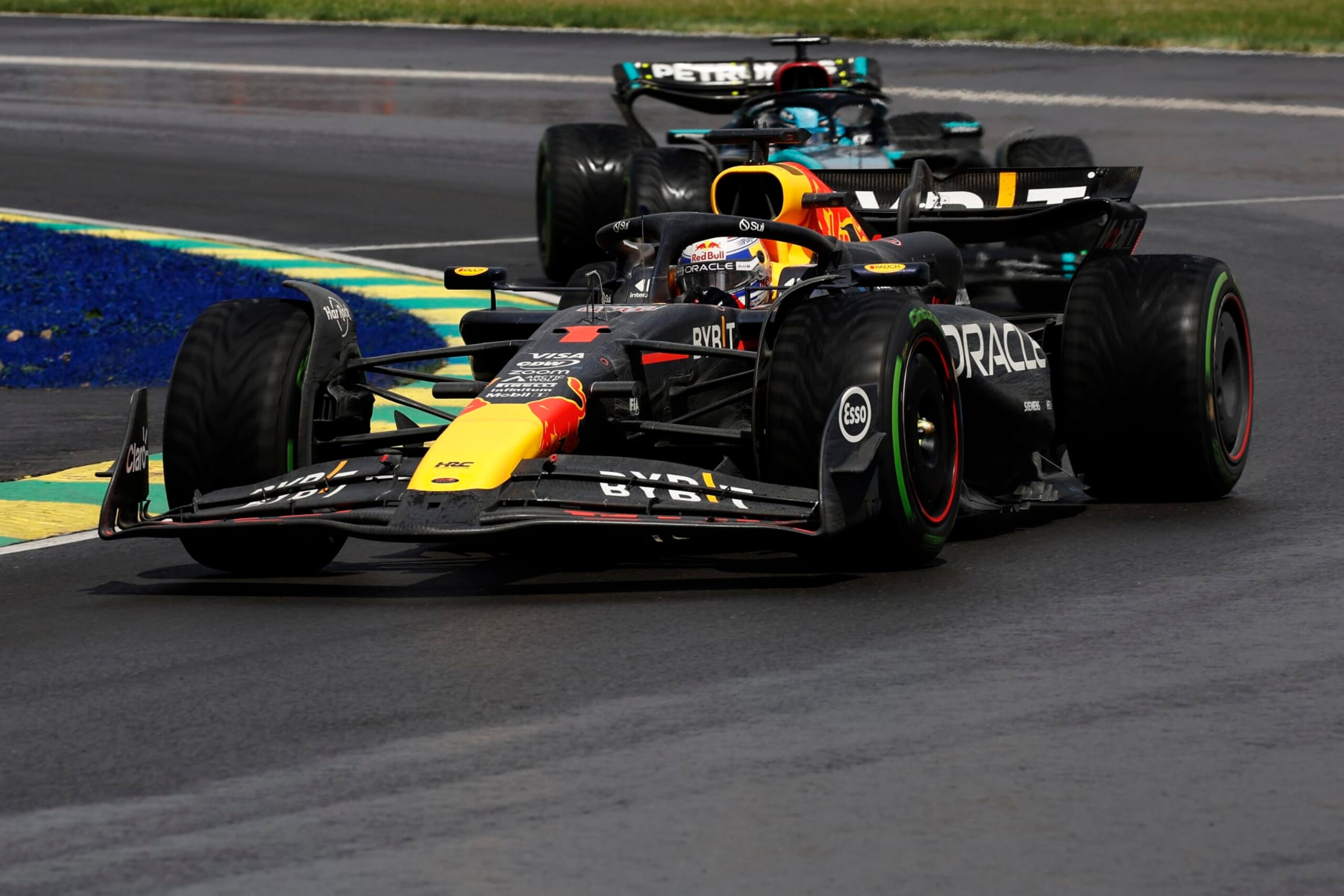 MONTREAL, QUEBEC - JUNE 09: Max Verstappen of the Netherlands driving the (1) Oracle Red Bull Racing RB20 leads George Russell of Great Britain driving the (63) Mercedes AMG Petronas F1 Team W15 on track during the F1 Grand Prix of Canada at Circuit Gilles Villeneuve on June 09, 2024 in Montreal, Quebec. (Photo by Chris Graythen/Getty Images)