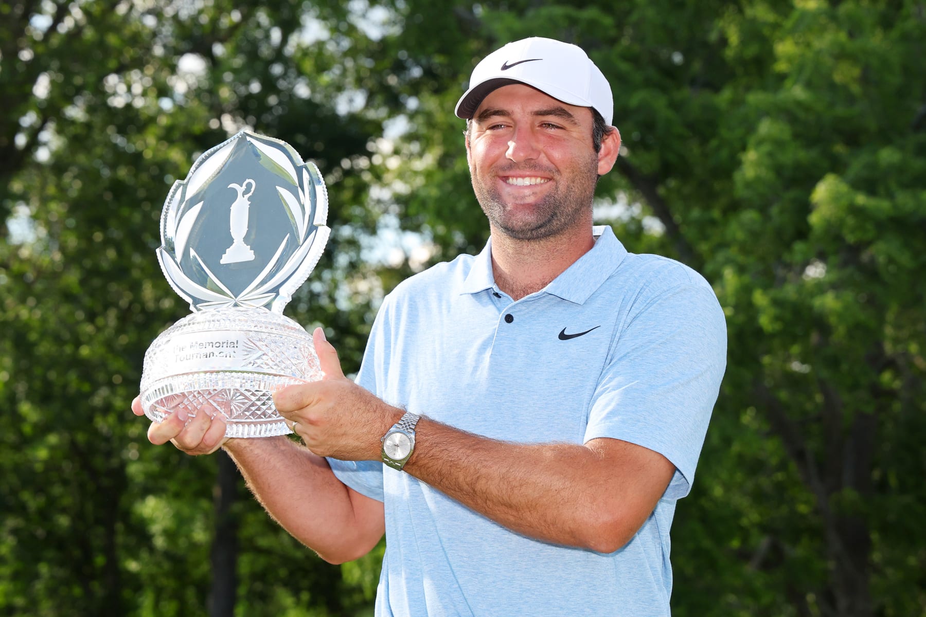 DUBLIN, OHIO - JUNE 09: Scottie Scheffler of the United States poses with the trophy after winning the Memorial Tournament presented by Workday at Muirfield Village Golf Club on June 09, 2024 in Dublin, Ohio. (Photo by Michael Reaves/Getty Images)