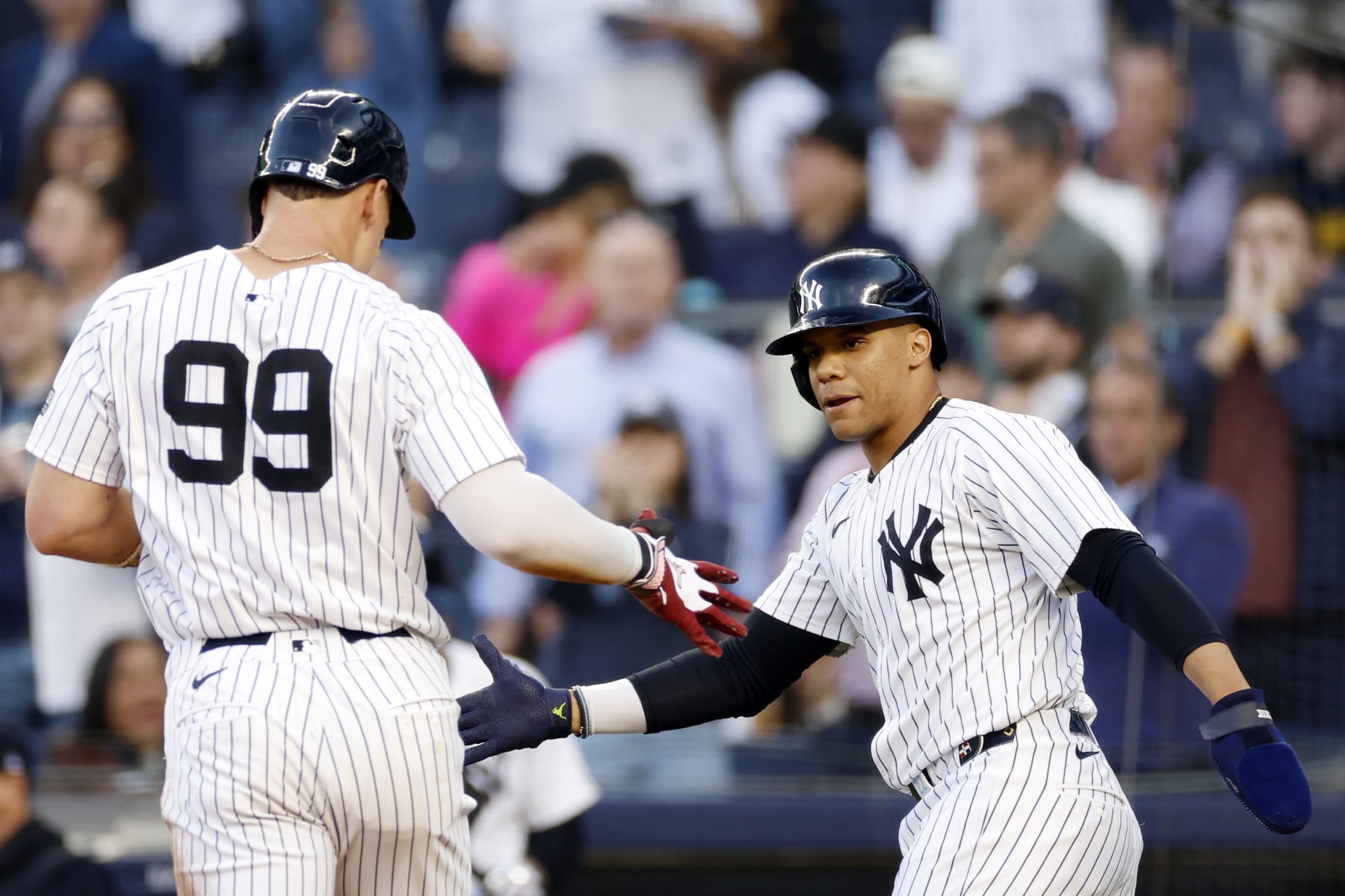 NEW YORK, NEW YORK - MAY 20: Juan Soto #22 celebrates with Aaron Judge #99 of the New York Yankees after both score on a 2-RBI double hit by Alex Verdugo #24 during the first inning against the Seattle Mariners at Yankee Stadium on May 20, 2024 in the Bronx borough of New York City. (Photo by Sarah Stier/Getty Images)