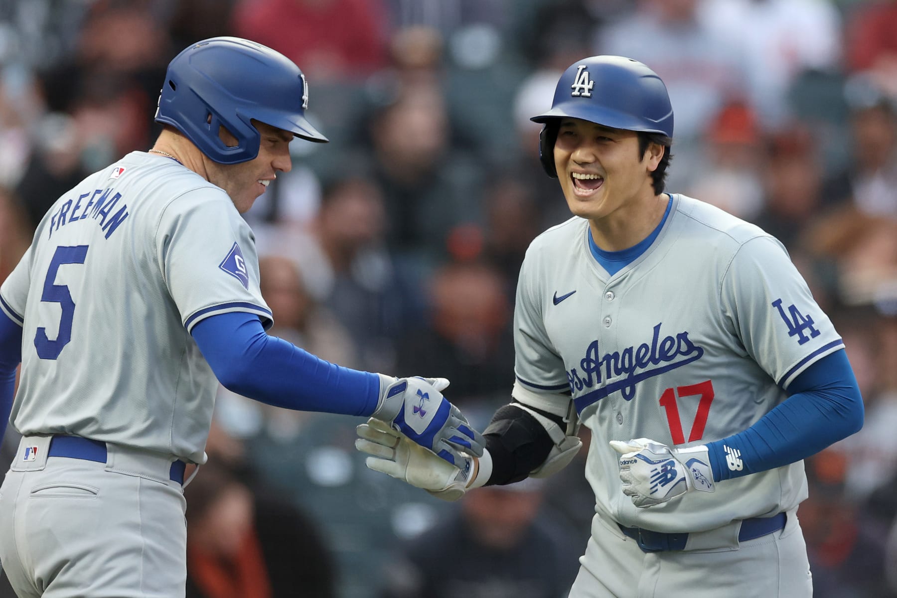 SAN FRANCISCO, CALIFORNIA - MAY 14: Shohei Ohtani #17 of the Los Angeles Dodgers is congratulated by Freddie Freeman #5 after he hit a home run against the San Francisco Giants in the fourth inning at Oracle Park on May 14, 2024 in San Francisco, California. (Photo by Ezra Shaw/Getty Images)