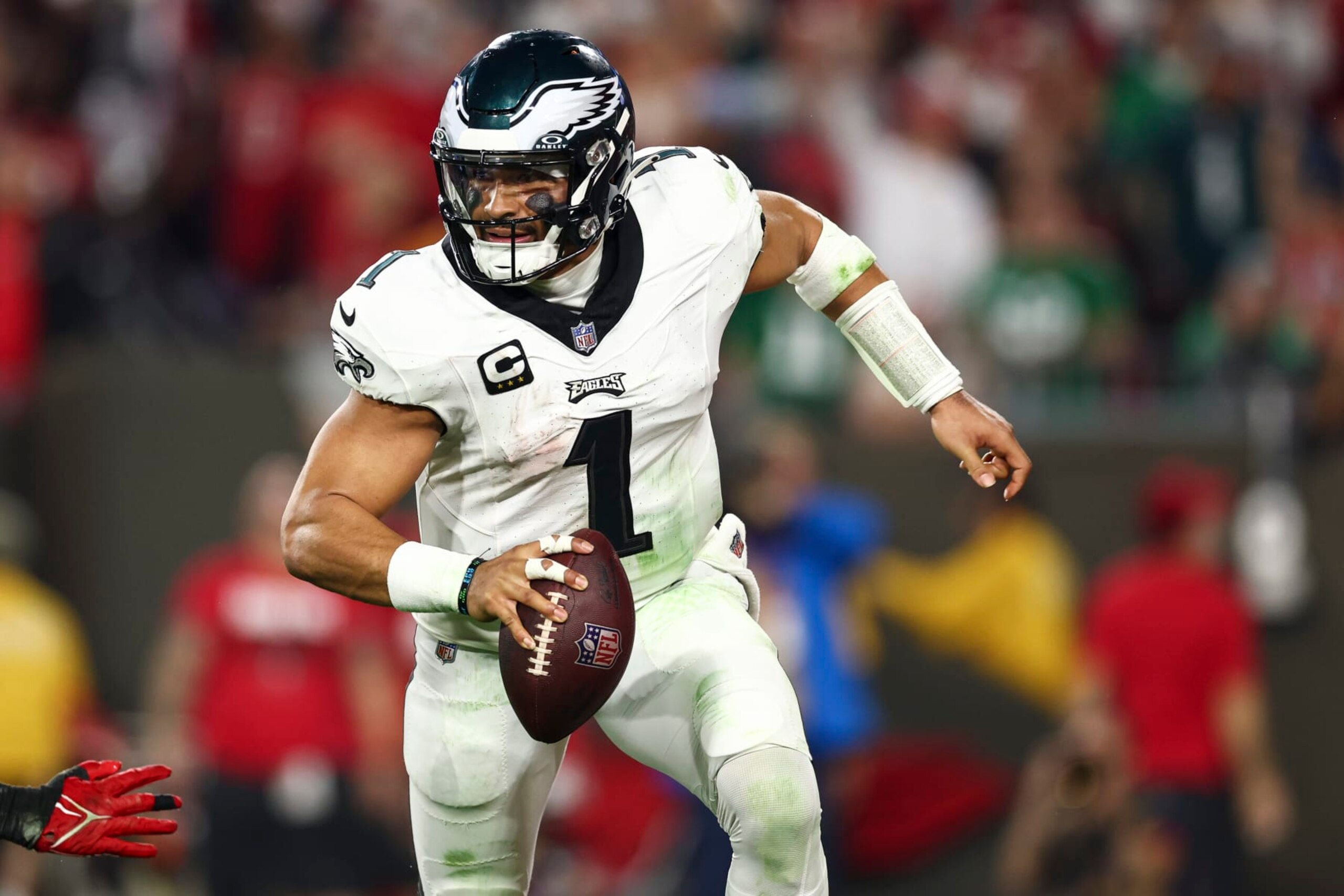 TAMPA, FL - JANUARY 15: Jalen Hurts #1 of the Philadelphia Eagles scrambles with the ball during an NFL wild-card playoff football game against the Tampa Bay Buccaneers at Raymond James Stadium on January 15, 2024 in Tampa, Florida. (Photo by Kevin Sabitus/Getty Images) TAMPA, FL - JANUARY 15: Jalen Hurts #1 of the Philadelphia Eagles scrambles with the ball during an NFL wild-card playoff football game against the Tampa Bay Buccaneers at Raymond James Stadium on January 15, 2024 in Tampa, Florida. (Photo by Kevin Sabitus/Getty Images)