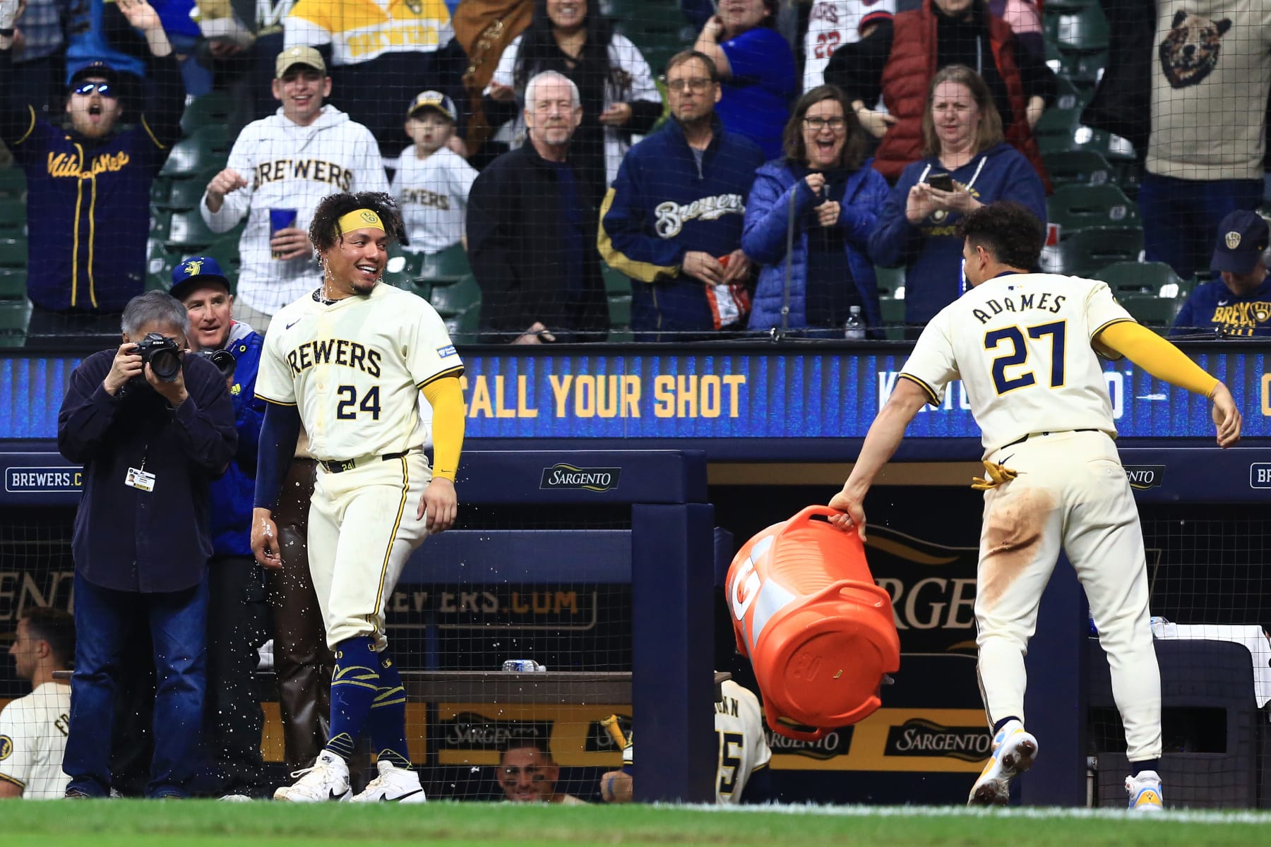 MILWAUKEE, WI - APRIL 05: Milwaukee Brewers catcher William Contreras (24) reacts to his gatorade bath by Milwaukee Brewers shortstop Willy Adames (27) during a game between the Milwaukee Brewers and the Seattle Mariners at American Family Field on April 05, 2024, in Milwaukee, WI. (Photo by Larry Radloff/Icon Sportswire via Getty Images)