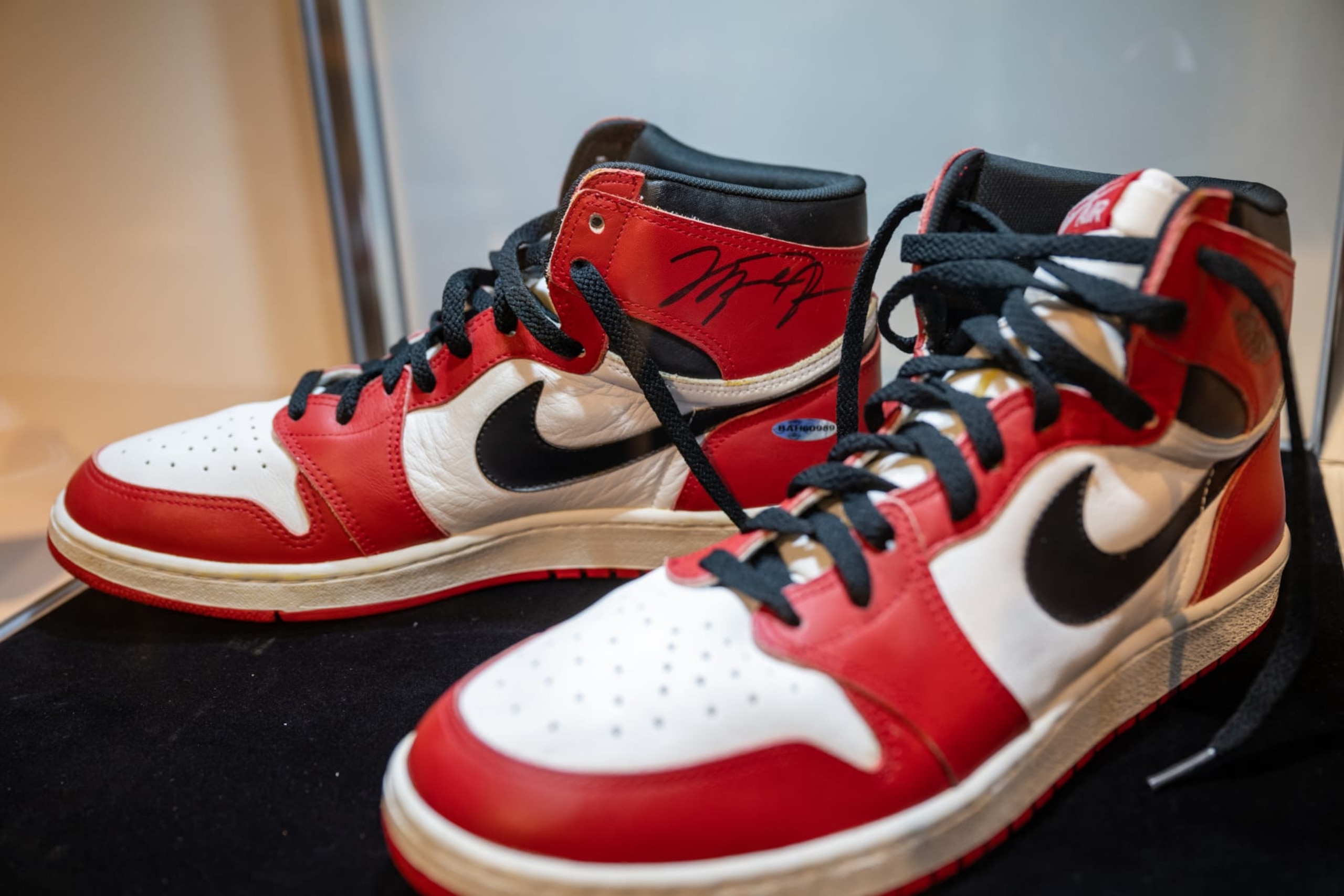 NEW YORK, NEW YORK - NOVEMBER 30: Signed Michael Jordan Nike 1985 'Player Sample' Air Jordan 1s  is on display during a press preview at Sotheby's on November 30, 2022 in New York City. They are expected to be auctioned for $100,000 - 200,000. (Photo by Alexi Rosenfeld/Getty Images)