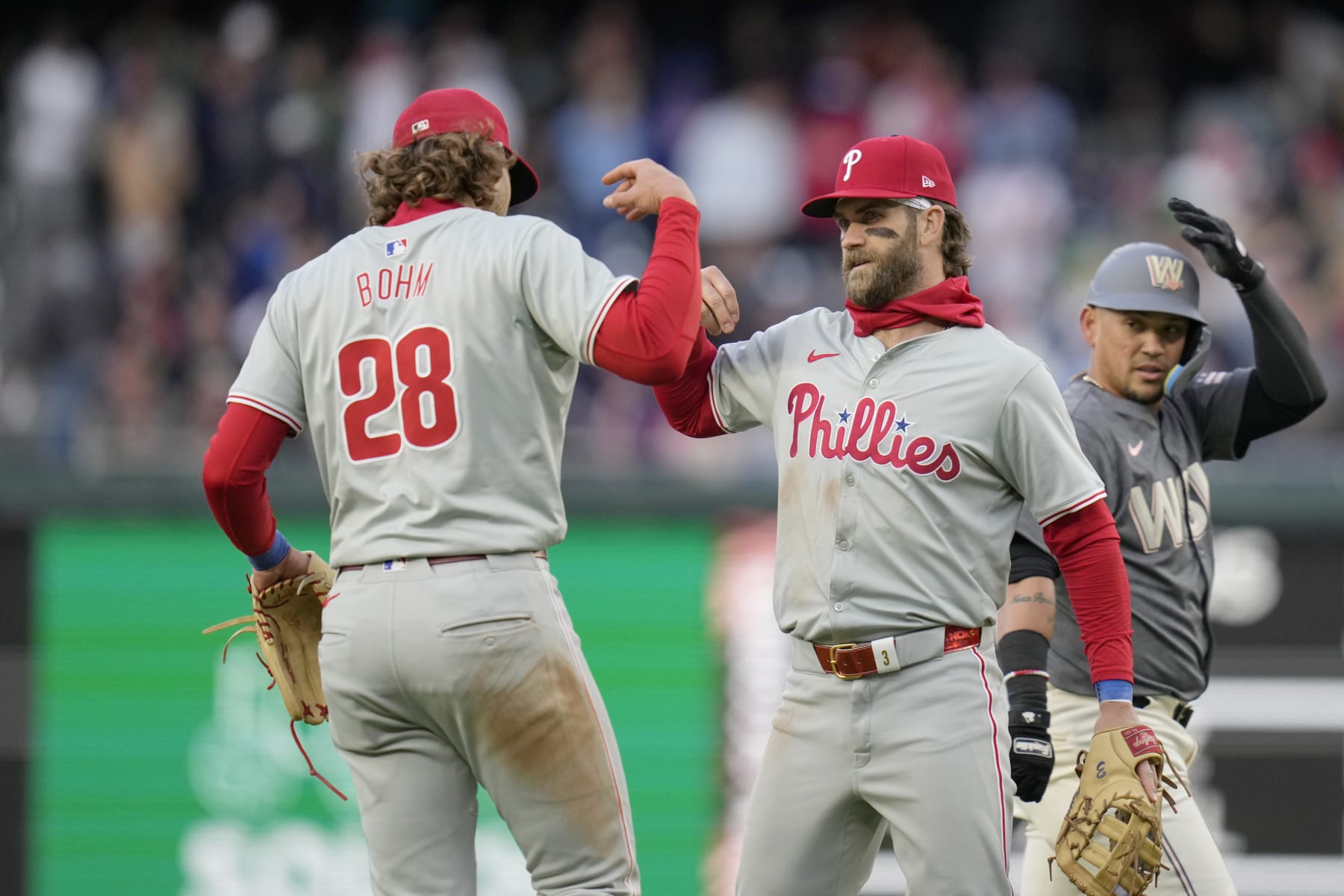 WASHINGTON, DC - APRIL 06: Alec Bohm #28 and Bryce Harper #3 of the Philadelphia Phillies celebrate after winning against the Washington Nationals at Nationals Park on April 06, 2024 in Washington, DC. (Photo by Jess Rapfogel/Getty Images)