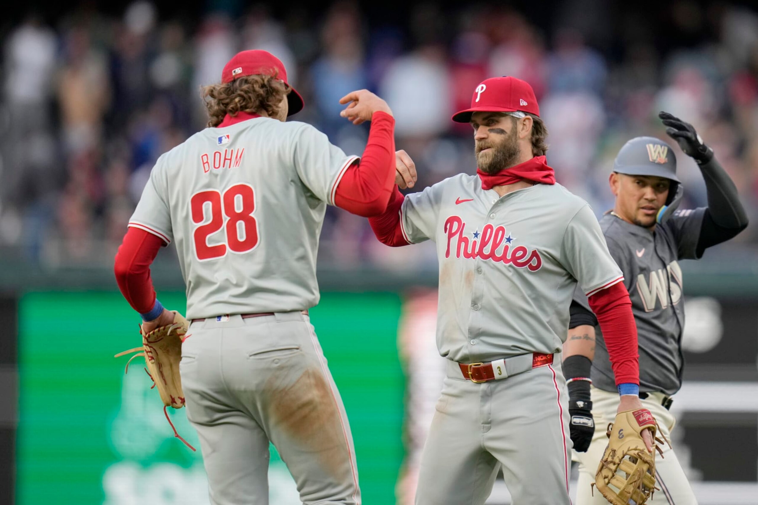 WASHINGTON, DC - APRIL 06: Alec Bohm #28 and Bryce Harper #3 of the Philadelphia Phillies celebrate after winning against the Washington Nationals at Nationals Park on April 06, 2024 in Washington, DC. (Photo by Jess Rapfogel/Getty Images)