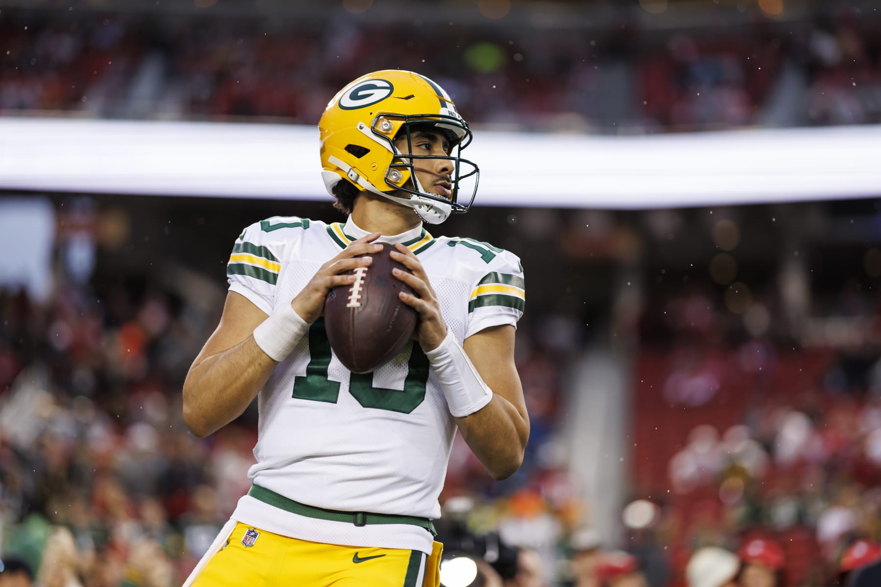 SANTA CLARA, CALIFORNIA - JANUARY 20: Jordan Love #10 of the Green Bay Packers looks to throw a pass during pregame warmups before an NFC divisional round playoff football game against the San Francisco 49ers at Levi's Stadium on January 20, 2024 in Santa Clara, California. (Photo by Ryan Kang/Getty Images)
