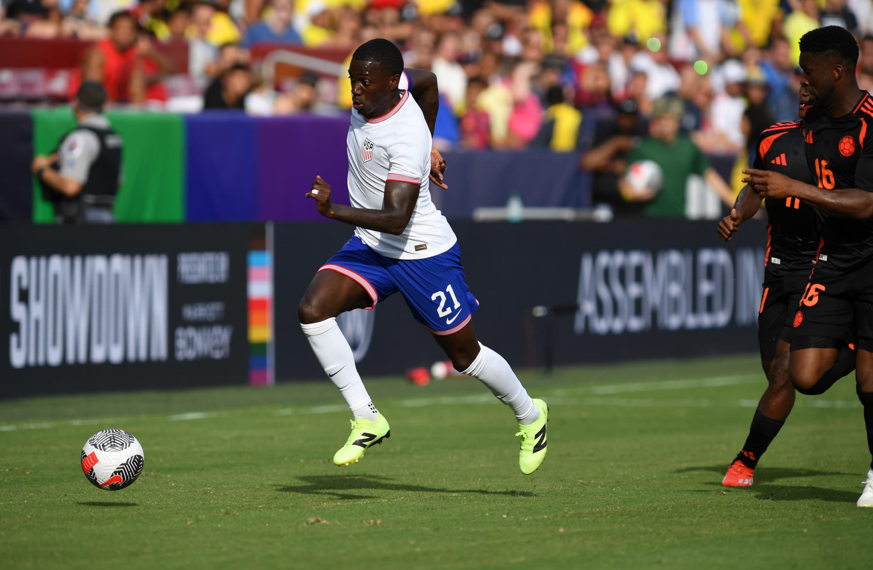 LANDOVER, MD - JUNE 08: United States forward Tim Weah (21) dribbles into space during the United States Men's National Team (USMNT/USA) U.S. Soccer Summer Showdown game versus Columbia on June 8, 2024 at Commanders Field in Landover, MD. (Photo by Randy Litzinger/Icon Sportswire via Getty Images)