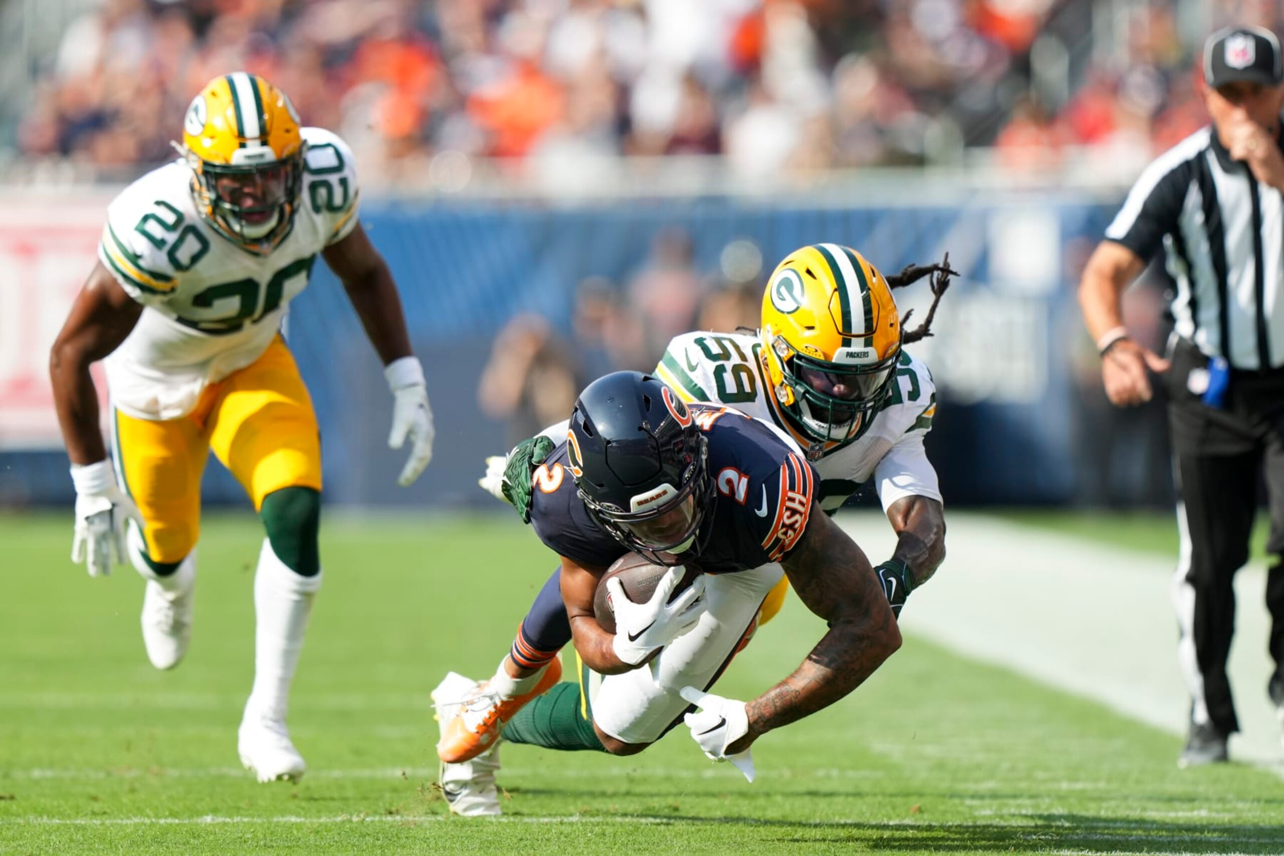 CHICAGO, IL - SEPTEMBER 10: Linebacker De'Vondre Campbell #59 of the Green Bay Packers tackles DJ Moore #2 of the Chicago Bears during an NFL football game against the Green Bay Packers at Soldier Field on September 10, 2023 in Chicago, Illinois. (Photo by Todd Rosenberg/Getty Images) CHICAGO, IL - SEPTEMBER 10: Linebacker De'Vondre Campbell #59 of the Green Bay Packers tackles DJ Moore #2 of the Chicago Bears during an NFL football game against the Green Bay Packers at Soldier Field on September 10, 2023 in Chicago, Illinois. (Photo by Todd Rosenberg/Getty Images)