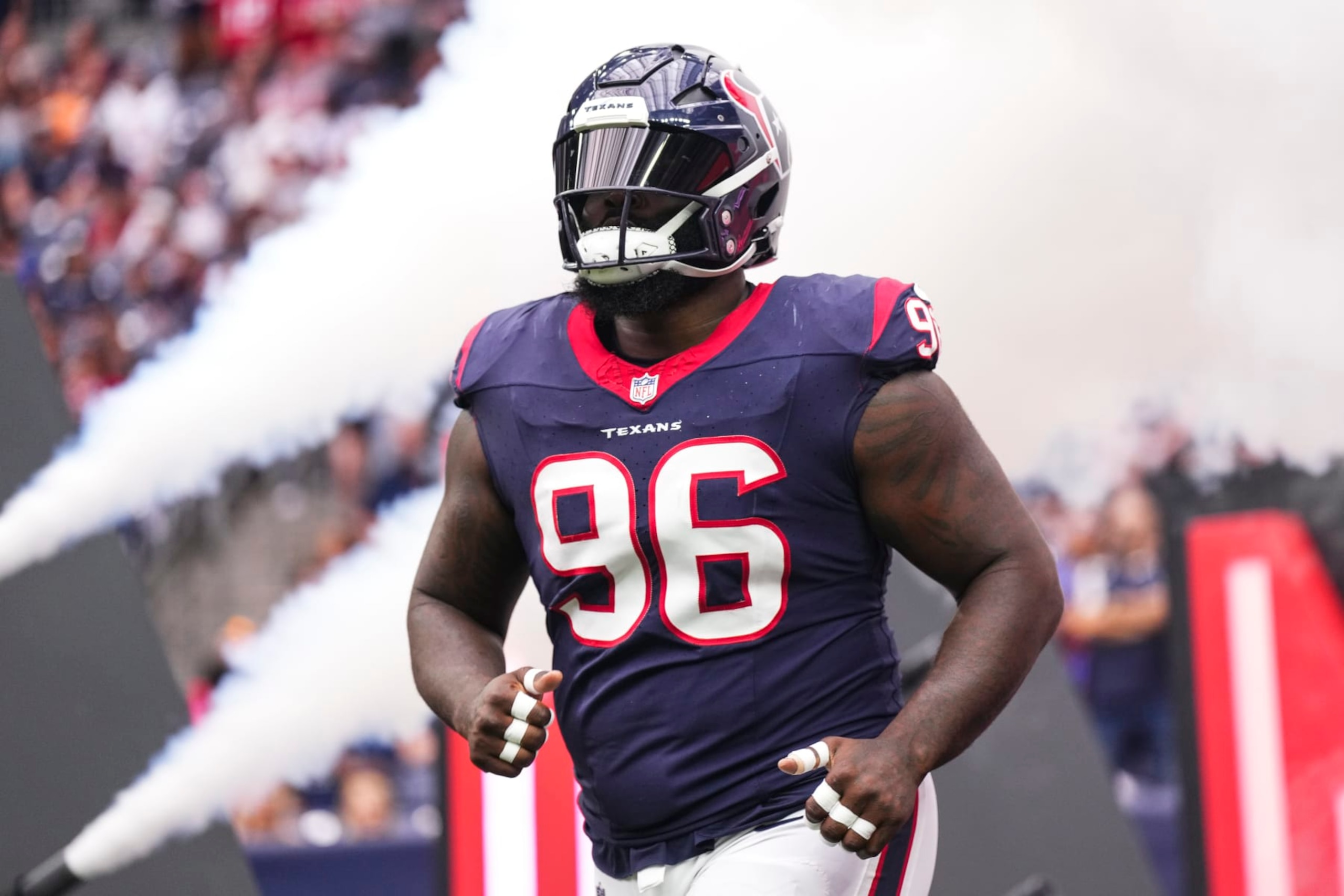 HOUSTON, TX - NOVEMBER 05: Maliek Collins #96 of the Houston Texans runs out of the tunnel prior to an NFL football game against the Tampa Bay Buccaneers at NRG Stadium on November 5, 2023 in Houston, Texas. (Photo by Cooper Neill/Getty Images) HOUSTON, TX - NOVEMBER 05: Maliek Collins #96 of the Houston Texans runs out of the tunnel prior to an NFL football game against the Tampa Bay Buccaneers at NRG Stadium on November 5, 2023 in Houston, Texas. (Photo by Cooper Neill/Getty Images)