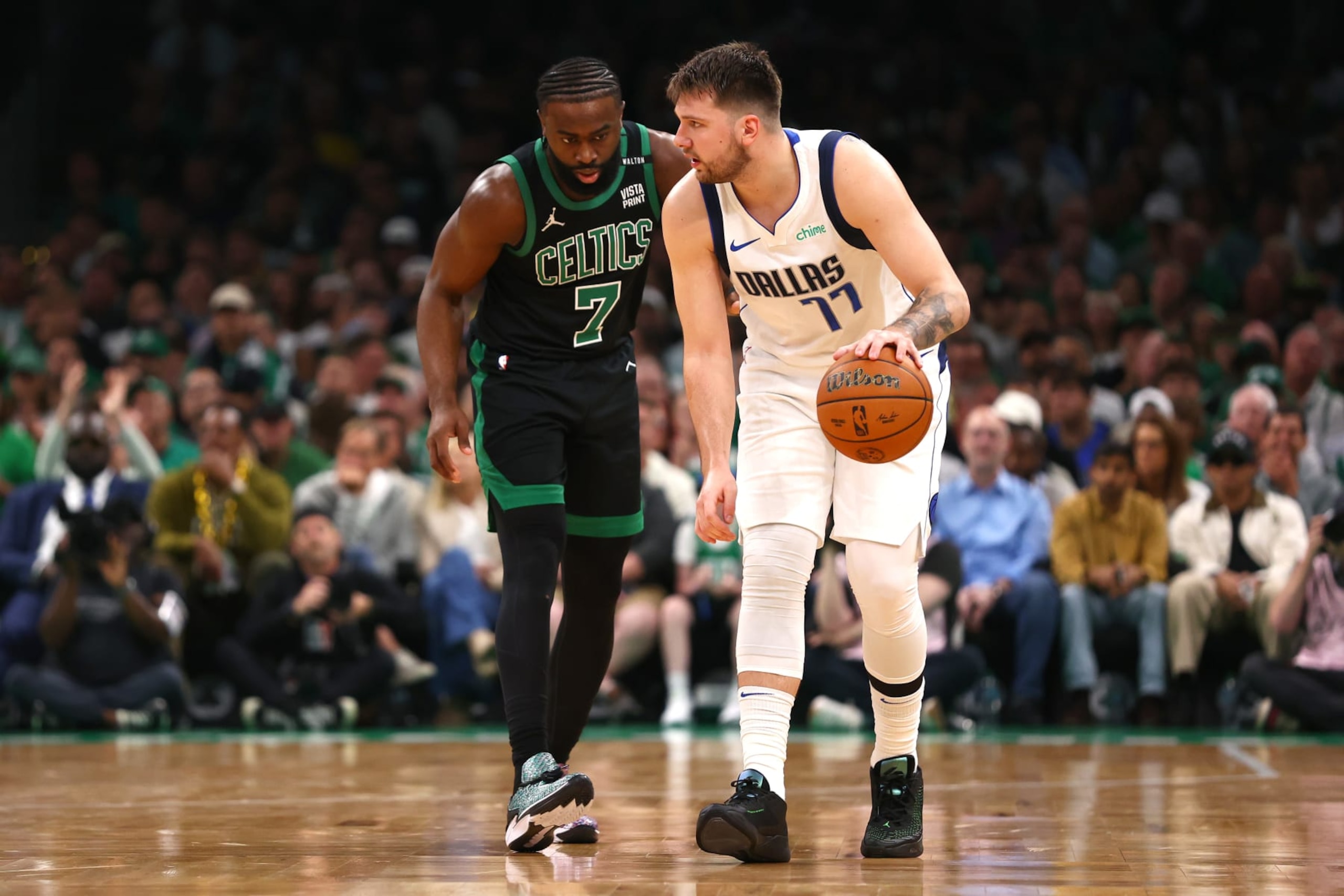 BOSTON, MASSACHUSETTS - JUNE 09: Luka Doncic #77 of the Dallas Mavericks dribbles the ball against Jaylen Brown #7 of the Boston Celtics during the first quarter in Game Two of the 2024 NBA Finals at TD Garden on June 09, 2024 in Boston, Massachusetts. NOTE TO USER: User expressly acknowledges and agrees that, by downloading and or using this photograph, User is consenting to the terms and conditions of the Getty Images License Agreement. (Photo by Maddie Meyer/Getty Images)