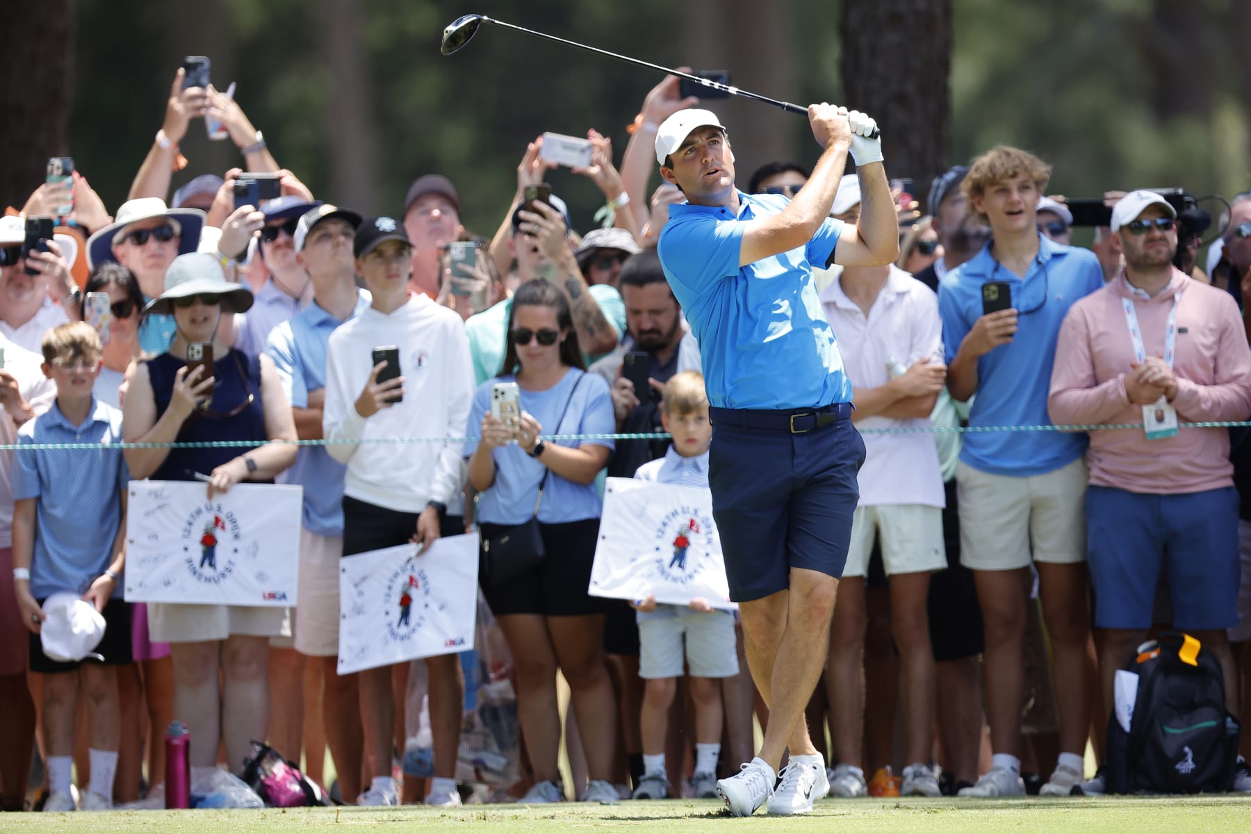 PINEHURST, NORTH CAROLINA - JUNE 11: Scottie Scheffler of the United States plays an approach shot from the 16th fairway during a practice round prior to the U.S. Open at Pinehurst Resort on June 11, 2024 in Pinehurst, North Carolina. (Photo by Alex Slitz/Getty Images)
