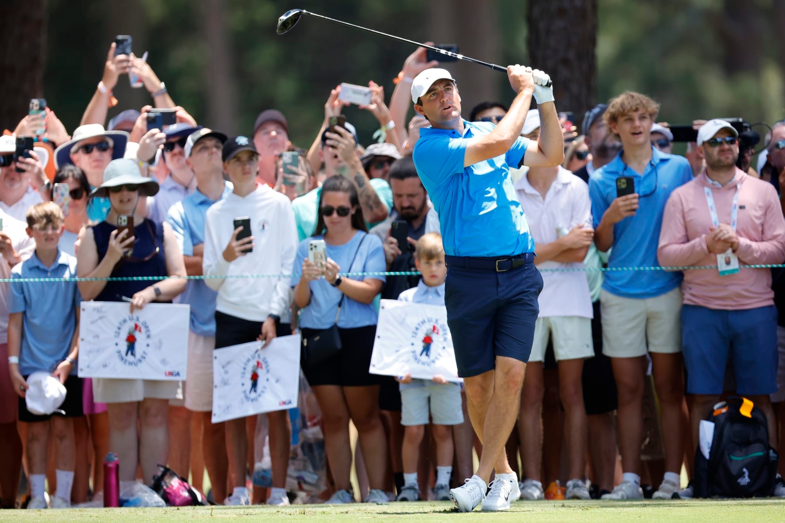 PINEHURST, NORTH CAROLINA - JUNE 11: Scottie Scheffler of the United States plays an approach shot from the 16th fairway during a practice round prior to the U.S. Open at Pinehurst Resort on June 11, 2024 in Pinehurst, North Carolina. (Photo by Alex Slitz/Getty Images)