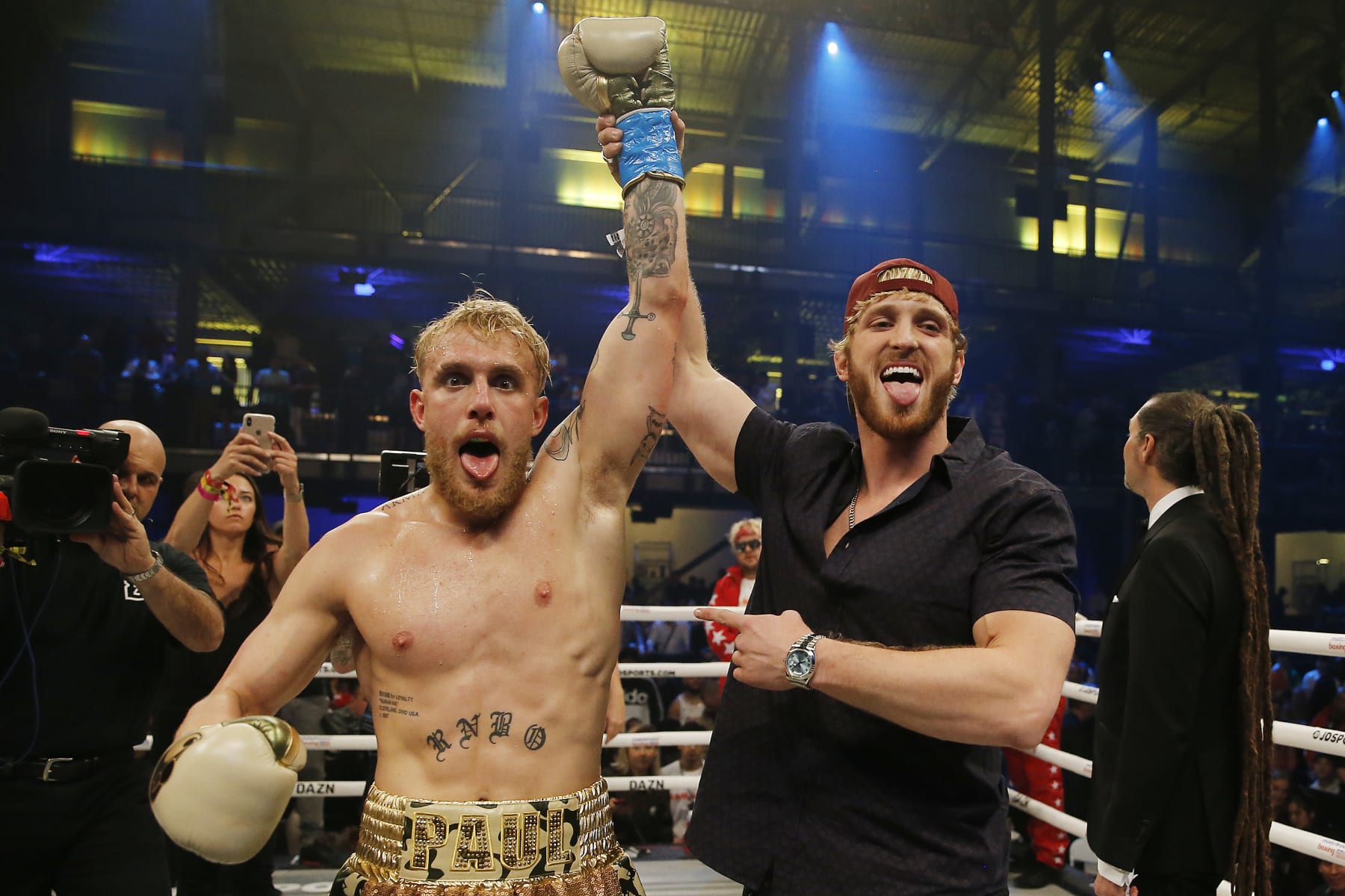 MIAMI, FLORIDA - JANUARY 30:  Jake Paul celebrates with his brother, Logan, after defeating AnEsonGib in a first round knockout during their fight at Meridian at Island Gardens on January 30, 2020 in Miami, Florida. (Photo by Michael Reaves/Getty Images)