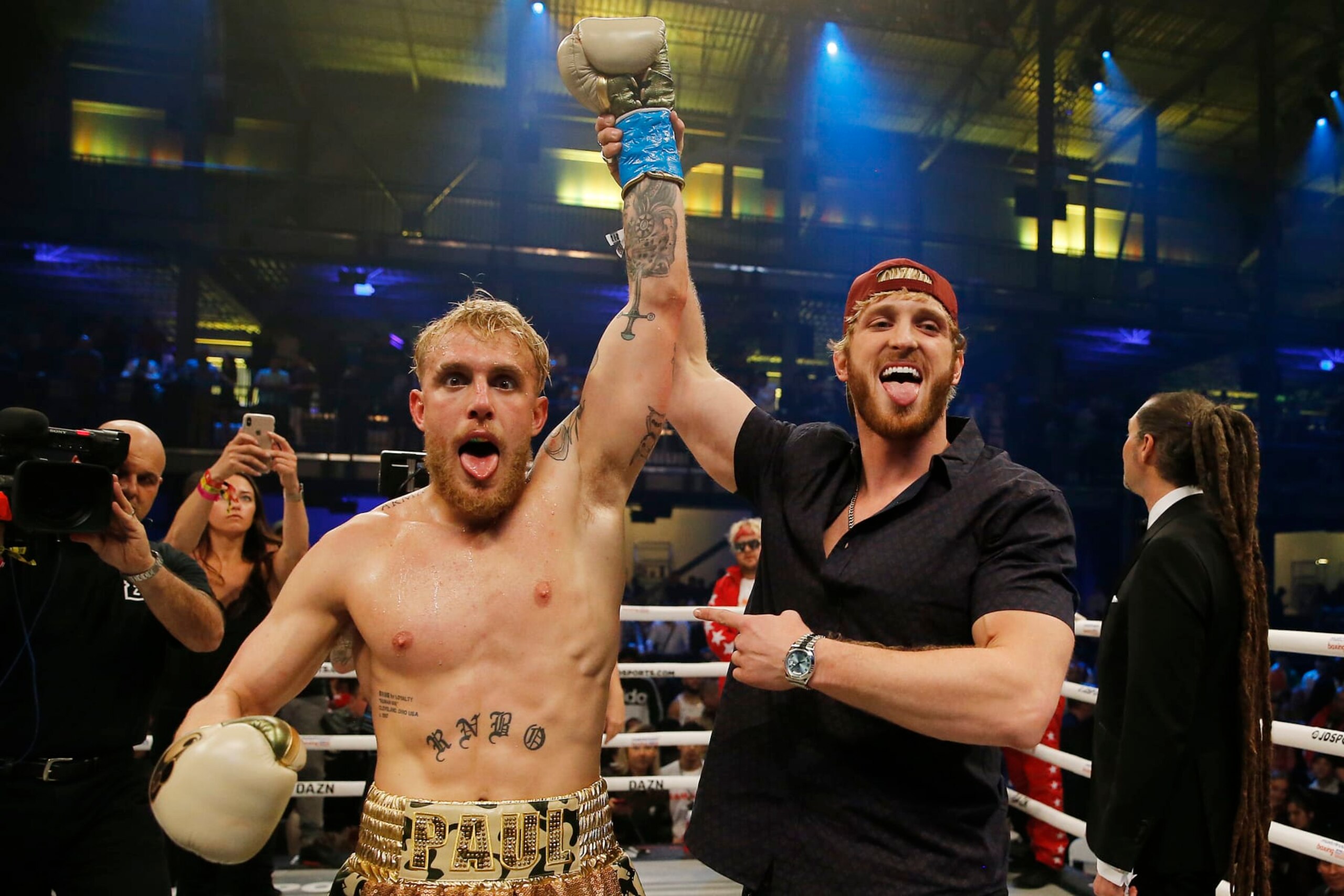 MIAMI, FLORIDA - JANUARY 30:  Jake Paul celebrates with his brother, Logan, after defeating AnEsonGib in a first round knockout during their fight at Meridian at Island Gardens on January 30, 2020 in Miami, Florida. (Photo by Michael Reaves/Getty Images)
