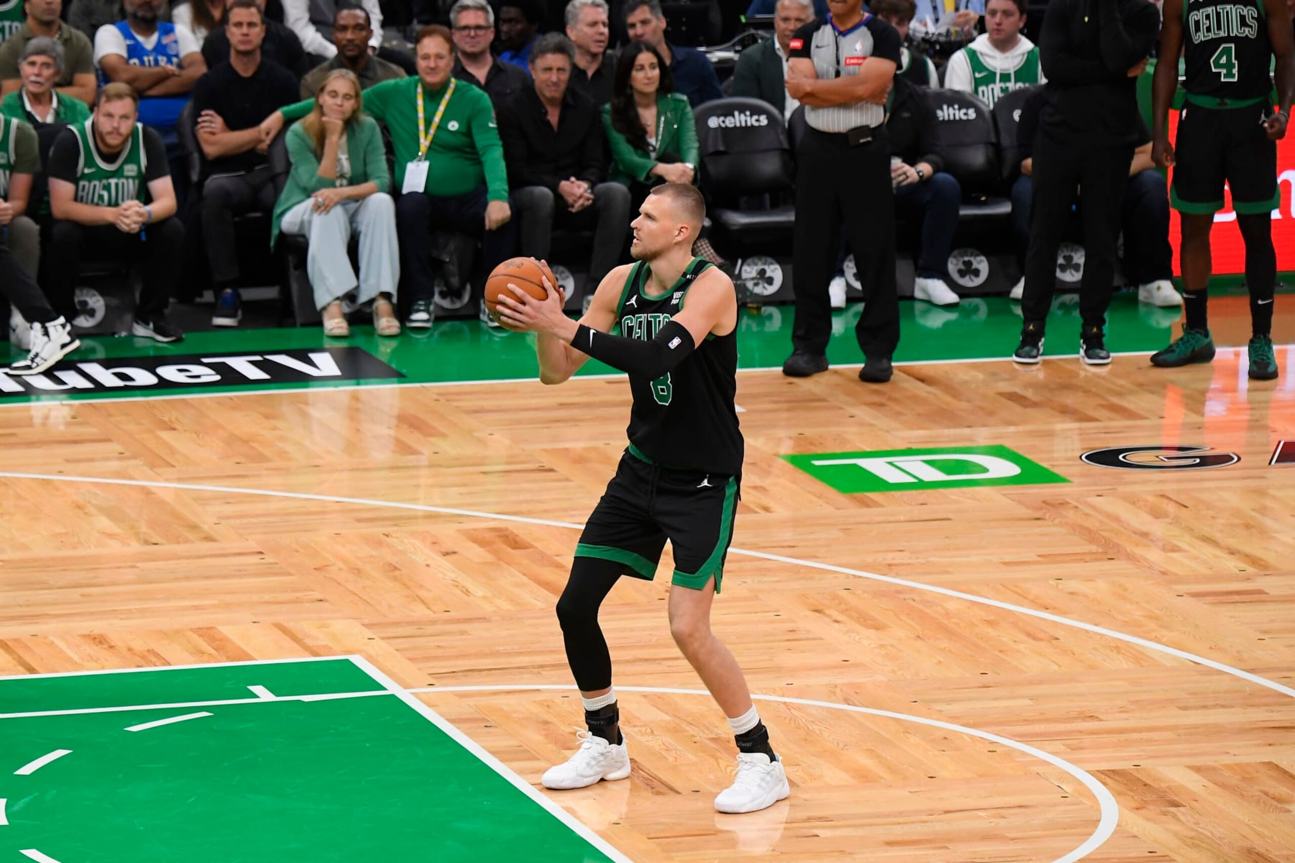 BOSTON, MA - JUNE 9: Kristaps Porzingis #8 of the Boston Celtics shoots a free throw during the game against the Dallas Mavericks during Game 2 of the 2024 NBA Finals on June 9, 2024 at the TD Garden in Boston, Massachusetts. NOTE TO USER: User expressly acknowledges and agrees that, by downloading and or using this photograph, User is consenting to the terms and conditions of the Getty Images License Agreement. Mandatory Copyright Notice: Copyright 2024 NBAE  (Photo by Brian Babineau/NBAE via Getty Images)